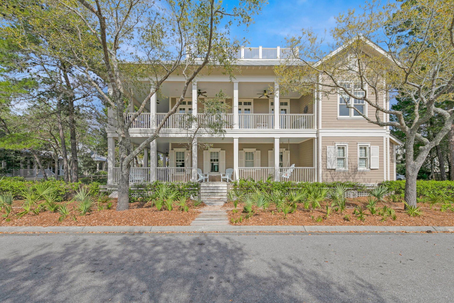 This is the BEST BUY in WaterColor and offers 3 levels of elegantly appointed living space! Enter the home from the inviting covered porch and walk into the first floor featuring 4 bedrooms & 3 full bathrooms. The master bedroom suite is on the first floor and has a spacious bath featuring double sink vanities, separate tub and shower. There is a grand staircase leading to the 2nd level with lots of windows. Upstairs you will find the showstopper in this home - a LARGE open living and dining space - an ideal gathering space for family and friends! The kitchen comes fully equipped with island, & opens up to generous living and dining space with lots of natural light, high ceilings with wooden beams in the living room, gas fireplace, & custom built-in