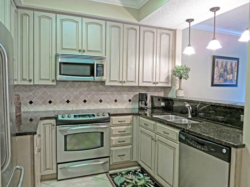 SAY HELLO TO GOOD BUY!!!Fabulous 2BR/2BA is located on the West wing of the Summit. Kitchen has been renovated with new cabinets, granite and stainless steel appliances. Tile throughout this lovely unit that has never been rented. Enjoy the large balcony that has entry from the living room and master bedroom. Tops'l Resorts offers great amenities such as a state of the art fitness center, a world class tennis facility, numerous nature trails, a putting green, indoor/outdoor pool, 600 ft of deeded private beach, 52 acres of private grounds and 24 hour security. Close to Grand Boulevard, Silver Sands Outlet, the famous Baytowne Wharf and many other fine dining establishments. A must see!!!