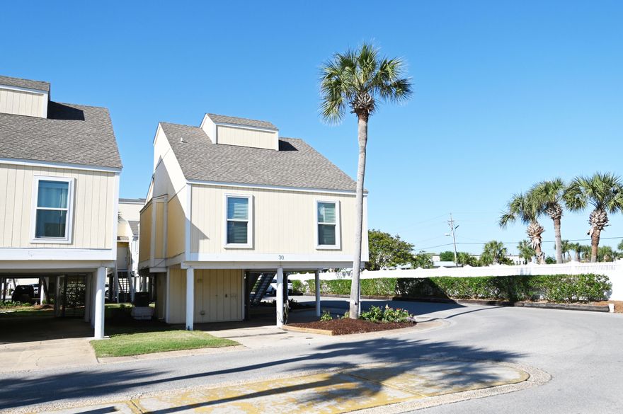 Major Price Reduction and ready to sell!Welcome Home!  This retro, fun Sandpiper Cove townhome is waiting for you.  The only one of its kind for sale right now.    So bring all of your toys because it has plenty of parking for a boat, truck, golf cart, and more! It sits on a beautiful corner lot with lots of grass and a nice garden area.  It has a new roof, windows, and doors. Brand new $3400 refrigerator that has never been used.Take a very easy walk across the street to the 1100 feet of pristine deeded private beach and the famous Rick's Sand Trap. Sandpiper has so many amenities like an owners marina, boat launch, canal boat parking for rent, tennis and pickle ball courts, 5 pools, 2 which are heated and three hot tubs which is unlike any other condo.