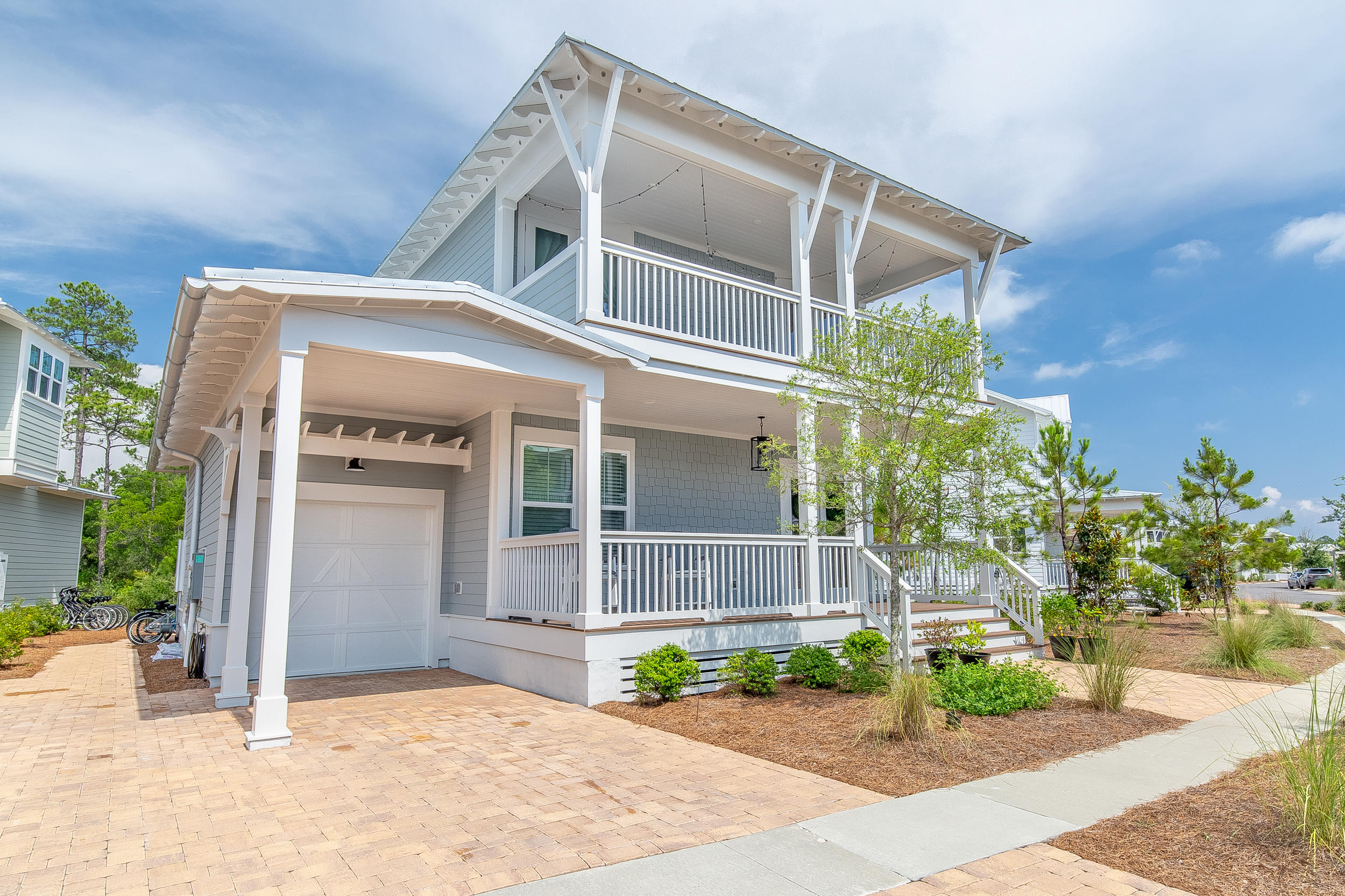 This homesite can't be beat! With a 77 foot front, it's the widest in the whole community and DOUBLE the width of the majority of sites in NatureWalk. The benefit = plenty of parking in the driveway, there's room for 4 cars! Also, plenty of room between neighboring homes, giving it a more private, pretty setting. Situated in a completed part of Naturewalk, nowhere near new construction, so you can just sit back on the porch and enjoy the sounds of nature. Popular Wind Chime home with guest bedroom downstairs and wide open family, kitchen & dining. The owner has added some extra special touches you are sure to love- custom stained pantry door, linear gas fireplace with ship lap accent wall in family room, and stained header at the foyer of the house.