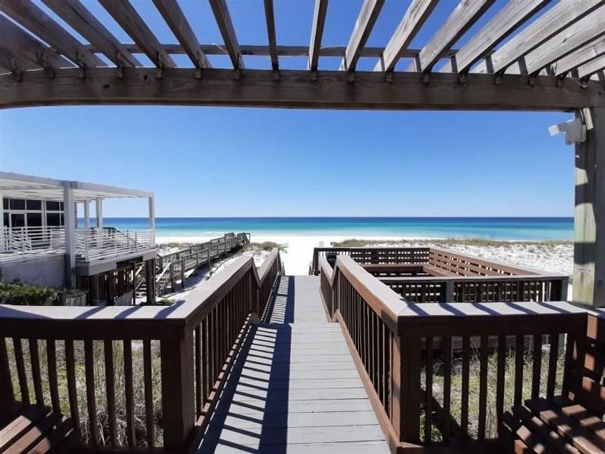 Terrific vacation rental investment, second home or full-time residence in the sought after Chateau La Mer.  Projected gross rentals of $35K.  This top floor 2 bedroom 2 bath condo with cathedral ceilings is located directly across from the community pool and tennis courts. The 200 feet of deeded beach access is across the street next to Captain Dave's Restaurant.  Tastefully designed kitchen features custom cabinets, breakfast bar,  stainless appliances and laminate floors.  Contemporary furnishings throughout .  Discover the beautiful white sandy beaches and emerald waters of the Gulf of Mexico.  Short proximity to dining, shopping, and beaches.  Washer and dryer convey. Buyer to verify all dimensions.  Call today to schedule an appointment to preview.