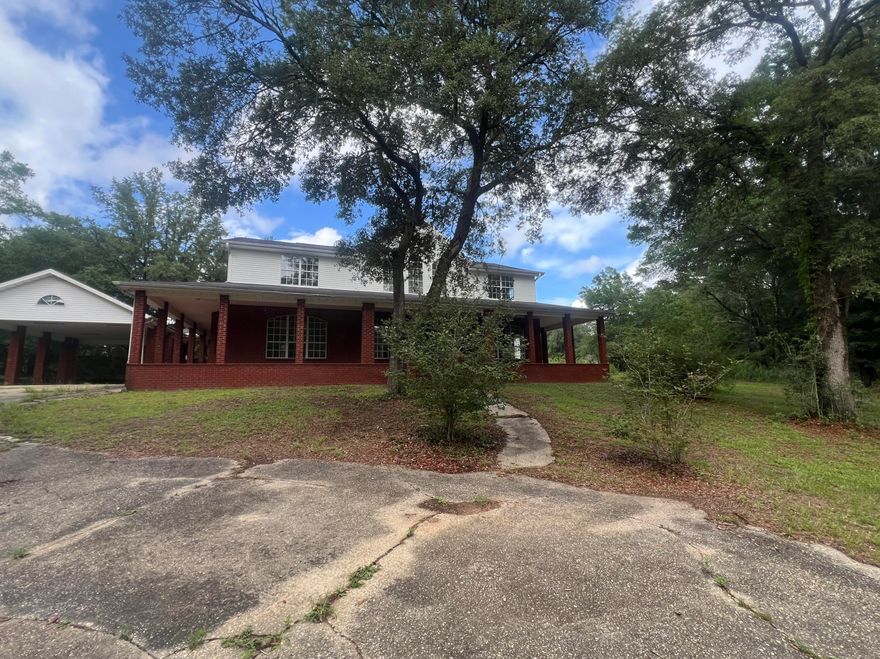 Built in 1996, this nearly 4000sf REO home, just may be the one for you! With an all brick exterior, wrap around porches and over sized carport parking, the appeal of the home cannot be denied, and don't miss the in-ground pool. Inside this spacious 5-bedroom, 3-bathroom home you will find plenty room for multi-generational families, growing kids, or extra space for those who love room to move. Resting on just under 3 acres, these is plenty of land to build additional structures or simply enjoy the landscape so solitude. This does need some repairs and therefore may not qualify for typical financing, but no fear - there are indeed financing programs that are available with the right lender.  Call today!