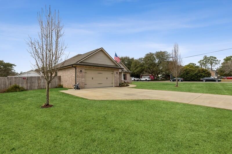 Come view this absolutely stunning corner lot home, constructed by Wilson Enterprises and winners of the Parade of Homes in 2014 and 2015, located just south of I-10! The home has incredible curb appeal, an open living room concept, split floor plan, and a ton of unique upgrades. As you enter, you'll be greeted by Cementina floor tiles, tray ceiling, vinyl decorated accent walls, double-panned windows, and epoxy floors in the garage. This smart home is configured with google nest, USB ported outlets, surround sound, and movement-detecting smoke detectors that illuminate. The master bedroom has spacious his and hers walk-in closets, dual vanity sinks, and an amazing shower. The patio has decorative lights and a fire-pit with a lovely outdoor seating arrangement to die for!