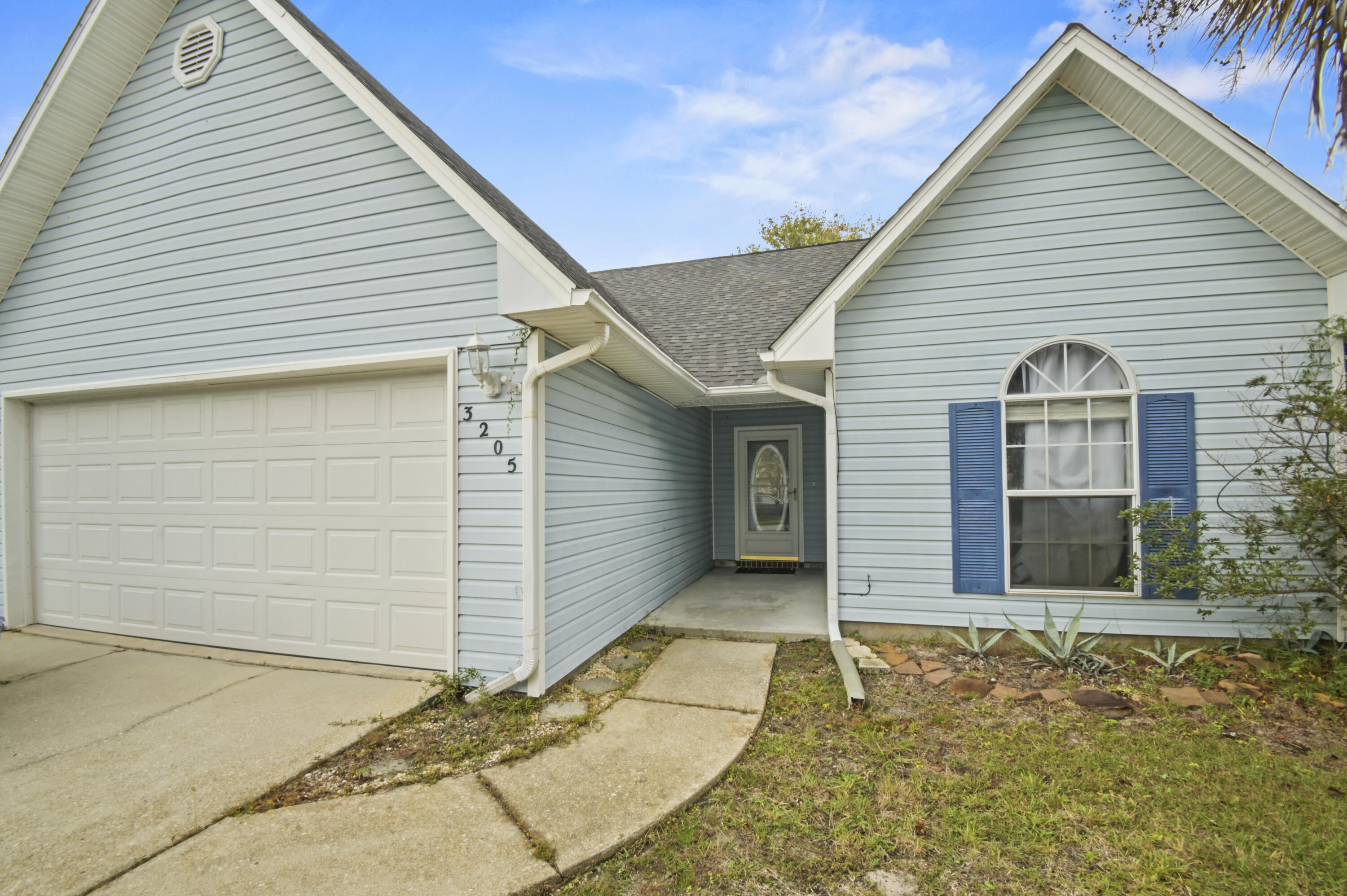 Wonderful starter home or great home for downsizing that is completely move in ready! This home is not only the LARGEST 3-BED HOME available in Gulf Breeze for under $300k, but also the ONLY one with a 2-CAR GARAGE! The layout of this home helps create an inviting central space connecting the kitchen, dining area, and living room, while ensuring privacy for the bedrooms. Each guest bedroom can fit a queen bed, and the master bedroom can easily accommodate a king bed. The master en-suite bathroom is massive and includes a deep closet too! The yard is spacious and features a covered patio, privacy fencing, and mature trees! This home is located only 10 minutes from the AWARD WINNING GULF BREEZE SCHOOLS, and only 1 minute away is a waterfront boat launch which doubles as a great fishing/swimming spot! Stop by today and make this house your home!