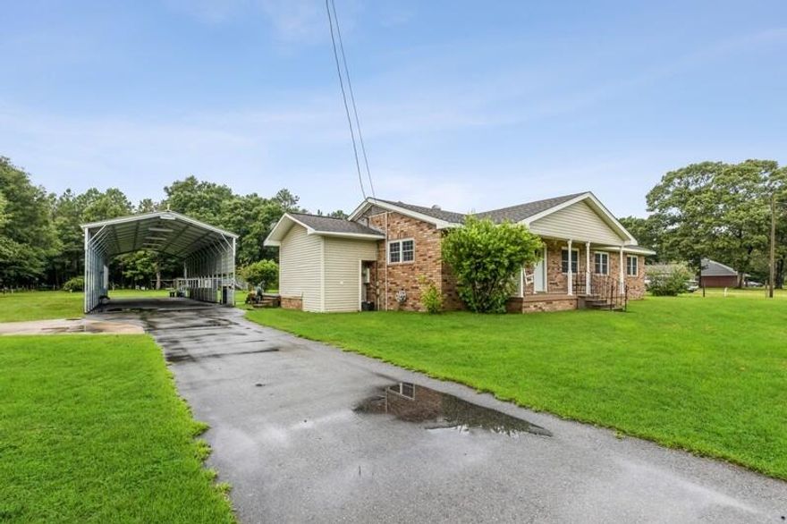 This is the country living home you've been looking for! Enjoy productive fruit trees of fig, plumb, pomegranate and peaches on an expansive lot just over one acre. The heart of this home, the kitchen features granite countertops and plenty of storage space -- with adjoining dining and family rooms -- make it ideal for gatherings. Walk outside to your backyard oasis, a north-facing paradise with a stretched patio that is just ready to host relaxing evenings. This property is immaculate, well-cared for, and ready for new owners - don't forget the 70' x 20' x 14' carport for your beautiful RV or at least eight cars.