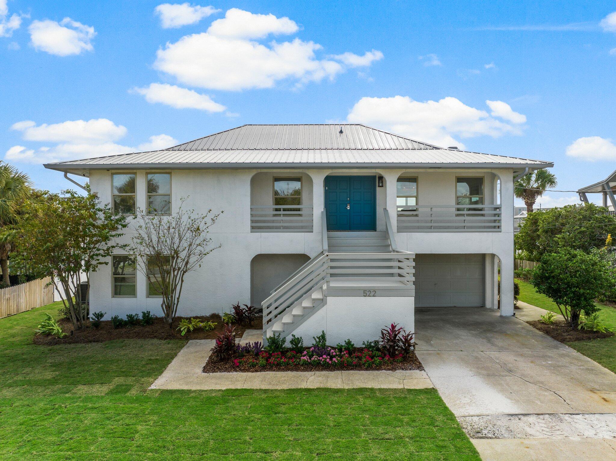 Welcome to the best of both worlds with the beach and boating lifestyle located on Holiday Isle. This fully renovated, 4-bedroom, 3-bathroom coastal retreat is just two blocks from the beach and sits on a deep-water canal, offering the perfect waterfront lifestyle. With spacious living areas on both levels. Stylish finishes, modern appliances, and expansive outdoor spaces create a welcoming atmosphere for relaxing or entertaining. Enjoy beach living, boat access, and luxurious comfort all in one stunning property. Ideal for vacation rentals or personal use!