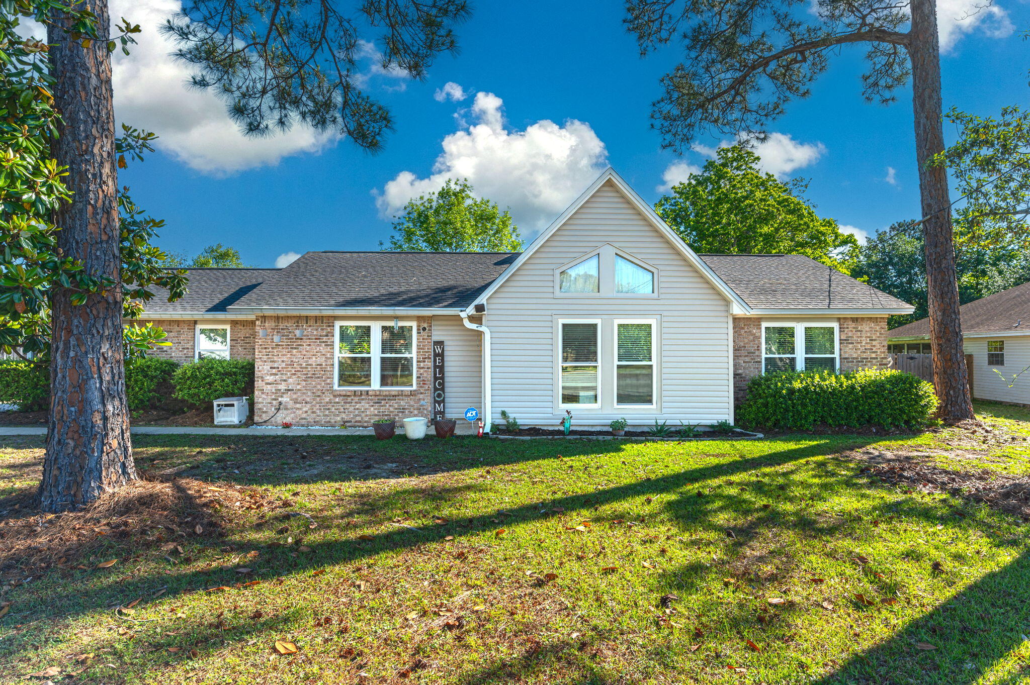 Great home located just 10 minutes from Hurlburt Field main  gate, makes for an easy commute. This 3 bedroom/2 bath home is move in ready  w/ New wood  laminate flooring in 2019 in Primary suite, Living room, and dining area. New carpeting in all guest bedrooms installed in 2019, New Roof 2019, All New windows 2020, HVAC 2016, sewer line to road replaced 2022. This home comes with brand new hurricane shutters installed 2023. Owners have taken great care of this home including new low maintenance vinyl siding on exterior of home w/ original brick exterior. This home has a great corner lot w/ a complete privacy fence in back yard to include shed for additional storage . Call to schedule your private showing today!