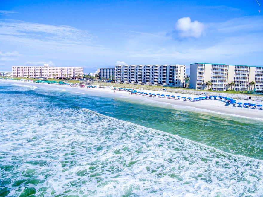 Excellent value! Priced below recent appraisal. A spacious two bedroom two bath condo in Inlet Reef on Holiday Isle with amazing views of the Gulf. Interior features include a large open kitchen with tiled countertops and a breakfast bar, tiled flooring throughout except the Master bedroom, double vanities, a nice walk in shower and huge walk in closet in the master bath and mirrored walls in the living and dining areas. The balcony offers great gulf views as well as views of the Destin Pass and the night lights over the Destin Harbor. Inlet Reef is a gated community with amenities including a heated pool, sauna, roof top sundeck, shuffleboard court, fitness center, tennis courts and game room. Conveniently located in the heart of Destin near shopping, dining and entertainment!