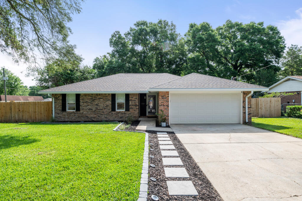 Mid-Century Roots. Minimalist Revival. One-of-a-Kind in Niceville.Situated on a corner lot at Carol Ann Manor in Niceville, this 2,021 square foot home is more than a renovation--it's a full-scale reinvention. Built in 1974 and taken down to the studs, it's been brought boldly into the modern era while honoring its mid-century bones with a clean, minimalist aesthetic.The heart of the home is the kitchen--and it's a showstopper. Wrapped in durable quartz countertops and anchored by a large center island with built-in storage on the front side, it offers a rare blend of design and utility. Textured subway tile climbs the backsplash, while open shelving replaces upper cabinets, letting the space breathe. A custom-built butler's pantry steps in to handle storage duty, complete with butcher block counters and smart, efficient layout.
The open flow carries you through the dining area and into the sunken family room, where a wood-burning fireplace adds warmth and a nod to the home's original character. Every finish in this home from the luxury vinyl plank flooring to the custom fixtures was handpicked to make the home feel not just new, but intentional.
The main bathroom was designed with everyday luxury in mind: a double vanity with brushed brass fixtures, designer tile flooring that fits the home's era perfectly, and a shower/tub combo with tile running all the way to the ceiling. It's clean, stylish, and built for use.
The primary suite might be modest in size, as you'd expect from a 1970s home, but it more than makes up for it in finishes and functionality. Two windows bring in natural light, a walk-in closet maximizes space, and the ensuite bathroom is a gem: ceiling-height tile in the shower, a sleek modern vanity, and glass barn doors that elevate the space with a touch of drama.
Don't forget the enclosed Florida room, perfect for enjoying a cup of coffee or unwinding at the end of the day, surrounded by softly tinted vinyl panels. Out back, mature trees and a brand-new privacy fence create a peaceful, shaded escape.
With a long list of upgrades including updated electrical, new roof, custom closets, luxury finishes throughout, and so much more, this home truly stands in a class of its own.
There is no other home like this one on the market in Niceville. Renovated. Reimagined. Ready.