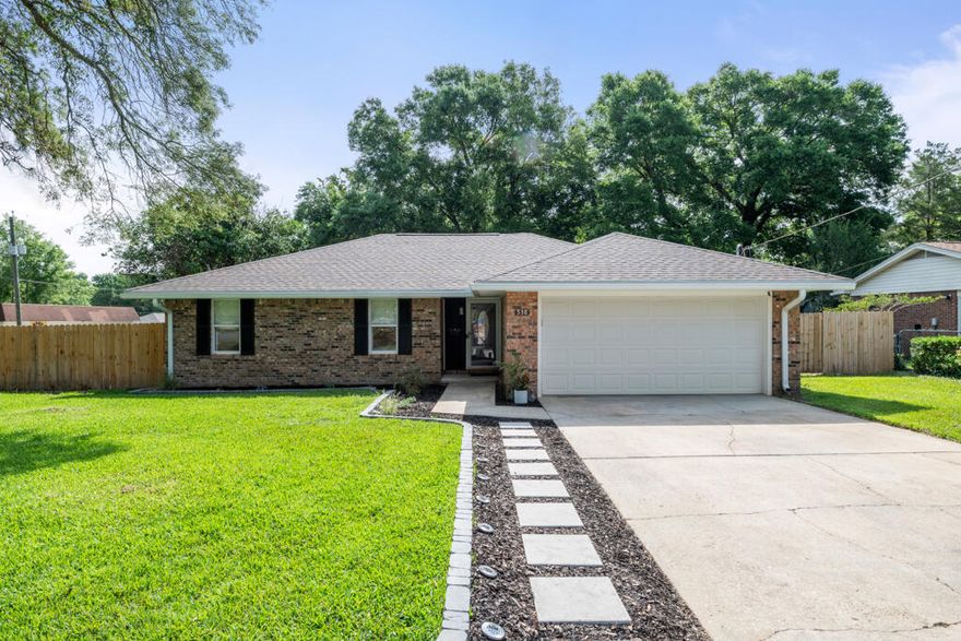 Mid-Century Roots. Minimalist Revival. One-of-a-Kind in Niceville.Situated on a corner lot at Carol Ann Manor in Niceville, this 2,021 square foot home is more than a renovation--it's a full-scale reinvention. Built in 1974 and taken down to the studs, it's been brought boldly into the modern era while honoring its mid-century bones with a clean, minimalist aesthetic.The heart of the home is the kitchen--and it's a showstopper. Wrapped in durable quartz countertops and anchored by a large center island with built-in storage on the front side, it offers a rare blend of design and utility. Textured subway tile climbs the backsplash, while open shelving replaces upper cabinets, letting the space breathe. A custom-built butler's pantry steps in to handle storage duty, complete with butcher block counters and smart, efficient layout.

The open flow carries you through the dining area and into the sunken family room, where a wood-burning fireplace adds warmth and a nod to the home's original character. Every finish in this home from the luxury vinyl plank flooring to the custom fixtures was handpicked to make the home feel not just new, but intentional.

The main bathroom was designed with everyday luxury in mind: a double vanity with brushed brass fixtures, designer tile flooring that fits the home's era perfectly, and a shower/tub combo with tile running all the way to the ceiling. It's clean, stylish, and built for use.

The primary suite might be modest in size, as you'd expect from a 1970s home, but it more than makes up for it in finishes and functionality. Two windows bring in natural light, a walk-in closet maximizes space, and the ensuite bathroom is a gem: ceiling-height tile in the shower, a sleek modern vanity, and glass barn doors that elevate the space with a touch of drama.

Don't forget the enclosed Florida room, perfect for enjoying a cup of coffee or unwinding at the end of the day, surrounded by softly tinted vinyl panels. Out back, mature trees and a brand-new privacy fence create a peaceful, shaded escape.

With a long list of upgrades including updated electrical, new roof, custom closets, luxury finishes throughout, and so much more, this home truly stands in a class of its own.

There is no other home like this one on the market in Niceville. Renovated. Reimagined. Ready.