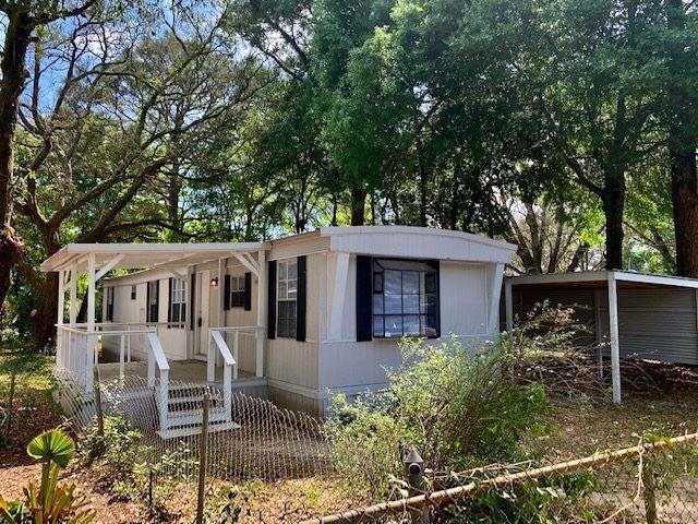 This freshly painted, charming 2 bed/1 bath mobile home is now available for lease in central Pensacola! Located just north of Cervantes off Green Street - minutes to everything! Fully renovated in 2020 - this super cute unit has built-ins galore for added storage, full washer/dryer off kitchen, with laundry walking out to carport and carpet in living/bedrooms. Large covered porch leads out to a large, fully fenced yard with fire pit; pets allowed with owner approval. Call today to schedule your showing before this is GONE!