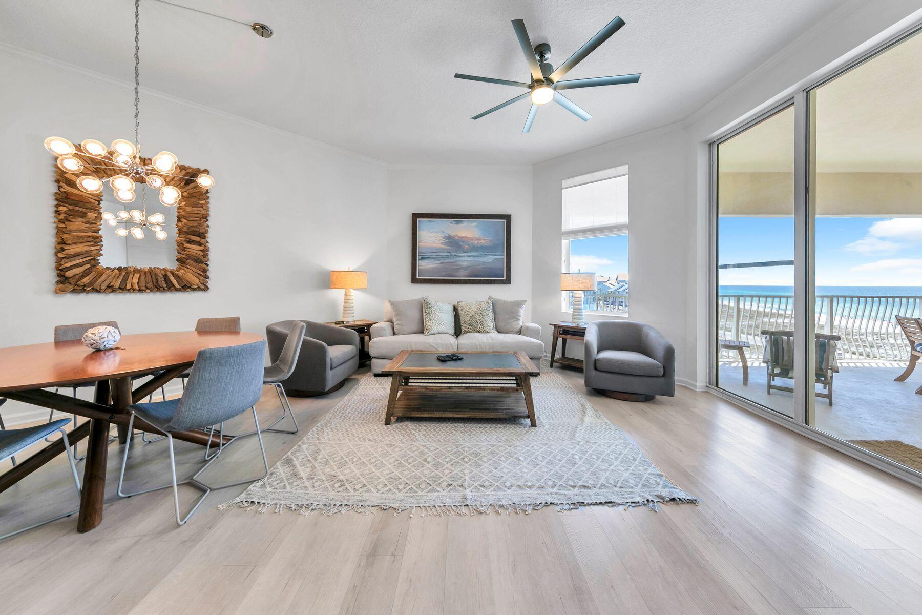 Seller has paid in full the special assessment that is due in August. Remodeled in 2021, it's rare to find such a spacious gulf-view condo at this price point. Situated on the top floor of a low-level building, this gorgeous beach retreat has soaring extra-high ceilings, new flooring, a recently replaced water heater and brand-new furniture. And, that's just for starters. All-new bathrooms including a stunning master bathroom with dimmable edison bathroom lighting and a large soaking tub make this beach facing retreat feel special. A stunningly renovated kitchen with an extended veined island overlooks the magnificent view. New lighting shows off the shiplap walls and upgrades perfectly. The entrance