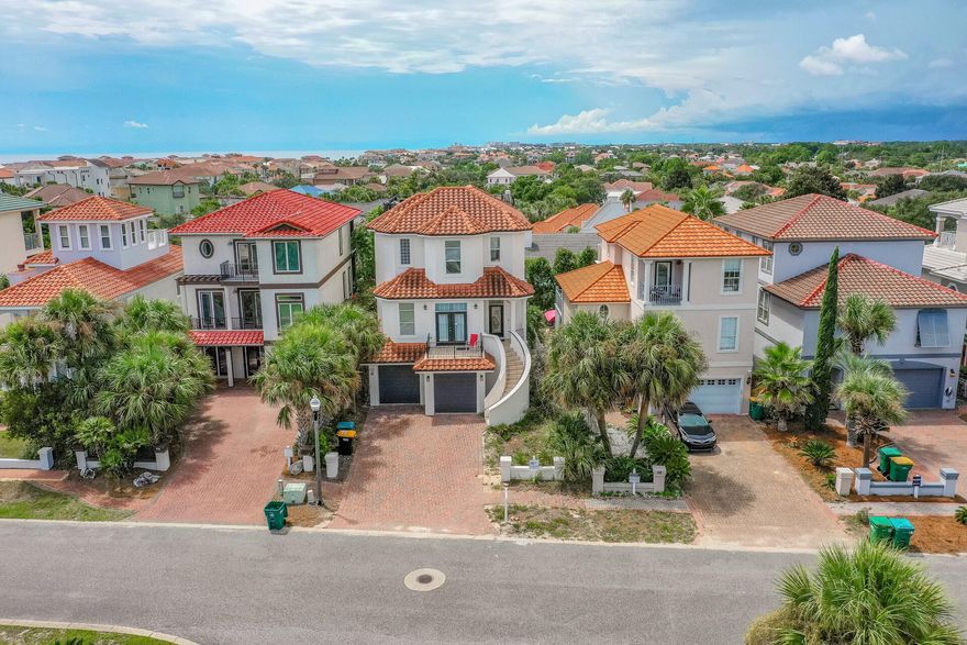 Rare Find! This gorgeous 5 Bedroom beach home has endless gulf views and bay views from the rooftop private terrace! This spacious and stunning 3 story beach home features both modern amenities and architectural character in a fantastic beach community. Your friends, family and vacationing guests will enjoy the PRIVATE/GATED Beach access just steps away from the home. The spacious kitchen hosts endless granite countertops, gas stove, stainless steel appliances and beautiful custom cabinetry. Terra Cotta one of the most highly desired neighborhoods in Destin. Enjoy unforgettable views multiple private balconies + the coveted Roof Top Terrace! 2 GARAGES. The community has a large pool, tennis courts, volleyball courts, BBQ pit, DEEDED/GATED beach access + more! Embracing the boundaries of Destin and Miramar Beach, Terra Cotta Terrace is a relaxing private vacation enclave in a phenomenal location. This Mediterranean inspired beach community is the perfect place to purchase a beach home that is boldly luxurious, and within minutes from everything you, your family, your friends and vacationing guests desire!