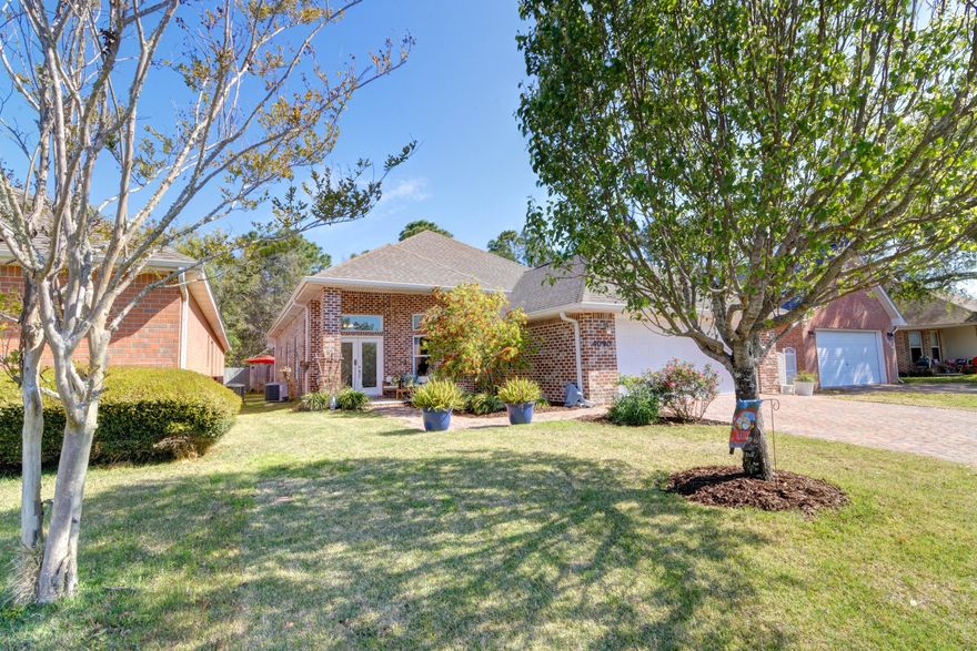 WELCOME HOME to Florida living at its best....This beautiful 3 bed 2 1/2 bath Custom built home is situated in the heart of the popular Oak Pointe community located in sought after Tiger Point East with easy access to Local parks, nature trails, stores and Hwy 98~Pride of ownership and attention to detail shines throughout ~You're 2477sq. ft. home is ideally located within the community and boasts lush landscaped front yard ,block paved driveway and covered front sitting porch~Your little piece of paradise awaits in the back garden ,fully fenced with raised stone flower beds  & flagged stone pavers leading to a corner patio area to relax, cook out and enjoy those wonderful Florida evenings.This custom built home greets you with a sweeping porch entry &  double glass doors to the foyer ... home is fully tiled in all wet areas with beautiful hardwood floors throughout the rest of the home~high ceilings and picture framed windows enhance the light and bright feel . Spacious gourmet kitchen features Custom wood cabinets ~ granite countertops, corner walk-in pantry & additional overhead storage, sleek S/S appliances with built in microwave and oven, center island houses the cooktop and overhead gourmet extractor. Long breakfast bar opens to the family room and enclosed sunroom adding plenty of natural light & providing a perfect family area to relax and also offers a large dining area to entertain. Master bedroom suite with double trey ceiling, crown molding & deep walk-in closet ~ Luxurious master bathroom with deep soaking tub and separate walk-in tiled shower. Master suite bathroom has plenty of dressing area & granite double vanity. This home has a split floor plan with good size additional bedrooms all with high ceilings /ceiling fans, double closets and additional overhead storage. Separate close off laundry room with sink and lots of cabinet storage. You will appreciate the attention to detail throughout this custom-built home with high base boards, bull nose corners, recessed lighting, foam insulation, impact windows and doors ~pre wired for security~circulation pump for instant hot water~ceiling WIFI router~nest thermostat and central vac....... are to name a few of the additional features you will enjoy.. Call today for an appointment to view this truly magnificent home. 

