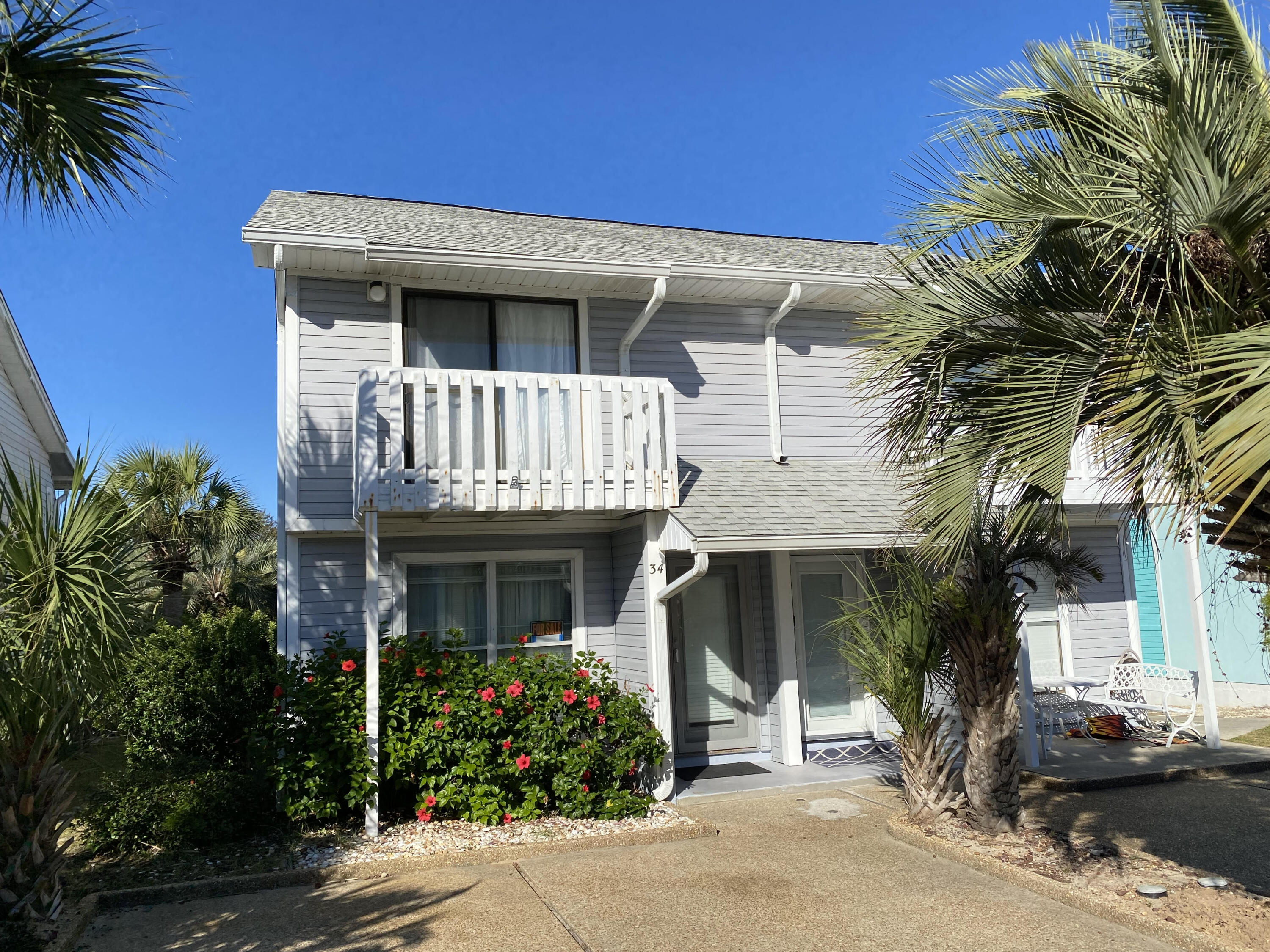 CURRENTLY UNDER CONTRACT, SELLER WILL CONSIDER BACKUP OFFERSThis end-unit, two-bedroom, townhome is in an INCREDIBLE location located just 120 yards from beach access 76 on the very desirable west end of PCB.  A great short-term rental investment or make it your own primary or secondary home.  Relax on your backyard deck with a fun cookout and enjoy the pond view or make the very short walk to the community pool.  Both bedrooms have balconies for those relaxing mornings and evenings.   HVAC about 1 year old, newer Water Heater and roof.  Villa Chateau is a small community with a community pool and close to Pier Park and many shops and restaurants.  All details and dimensions are approximate and should be verified if important.