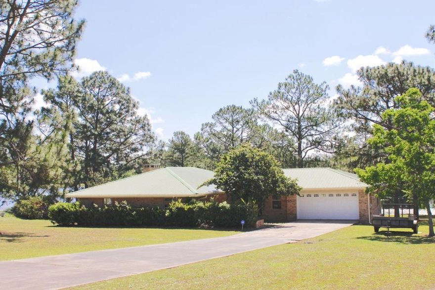 Premium quality describes the makeover & restoration of this 1898 S.F. 3bed/2ba custom built home located on one of Northwest Florida's premier bass & bream fishing lakes! All new quartz kitchen countertops, all new cabinets, marble counter tops in the bathrooms, All new stainless steel appliances, new cooktop with stainless steel range hood, all new tile & carpet flooring through out, all new custom lights & fans, refurbished metal roof including new flashing and all new screws through out. All new gutters, new garage door and freshly painted through out the complete home including the decks. All brick, low maintenance. all you have to do is move in and start fishing and golfing!