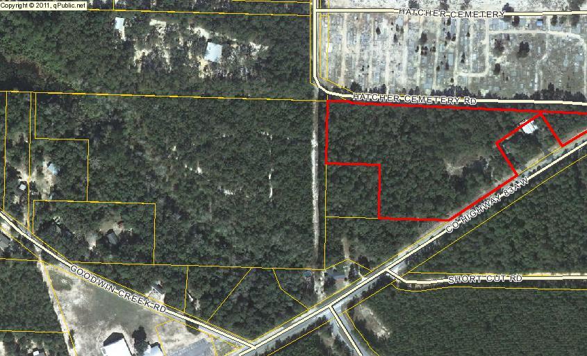 20 acres+/- on the west side of Bay Loop Road, great potential for a development or your on private get away. Call Today for Details !