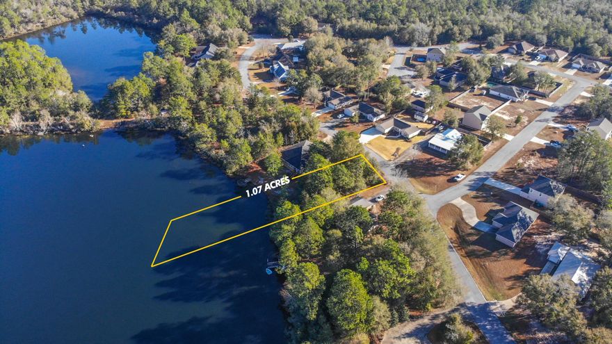 Exceptional waterfront lot on Magnolia Lake within the city limits and only 5 minutes to downtown DeFuniak Springs. Magnolia Lake Estates is a small community with one entrance/exit for additional privacy. The views are breathtaking, as the property across the lake is undeveloped and beautifully wooded. Minimum 1500sf single family home with no minimum built out time and no manufactured homes allowed. The slope to the lake is quite gentle, allowing a cost effective build. And the fish are biting! Electric available with hookup to city water and city sewer as well as natural gas. Whether you plan to invest for later or build now, this is a wonderful waterfront opportunity in Walton County, one of the fastest growing counties in the nation.