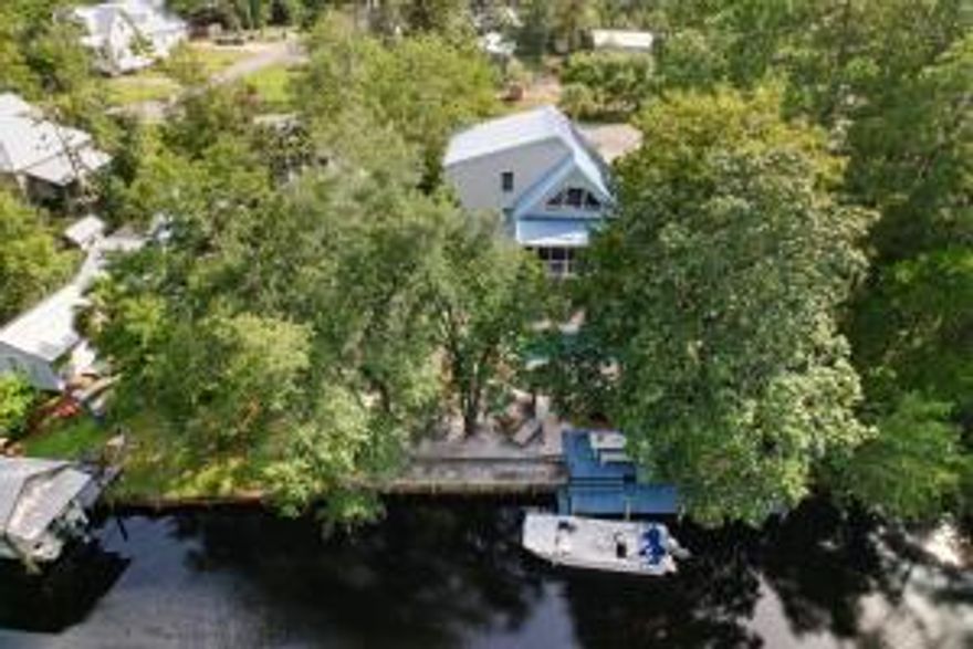 Waterfront home under 1 Million, and 6 minutes from Grayton Beach!! NO HOA!! This gorgeous 3 story, traditional home is full of character and sits on a deep water canal leading to the Choctawhatchee Bay and features a pool. You will enjoy the privacy of the quiet cul-de-sac street in highly desirable Point Washington. Each floor of this home has qualities you can't resist. The main floor has a ''Chef's Dream'' 2nd kitchen with additional 650 sq.ft.(Walk-in cooler and freezer convey), but everything is removable. Boasting 2 master bedroom suites, a third bedroom plus a loft which could be a 4th bedroom, this home is very spacious. A 2nd floor screened in porch overlooking the pool and canal and Ralph Lauren paint and Australian bamboo floors add to its charm. Great for entertaining!