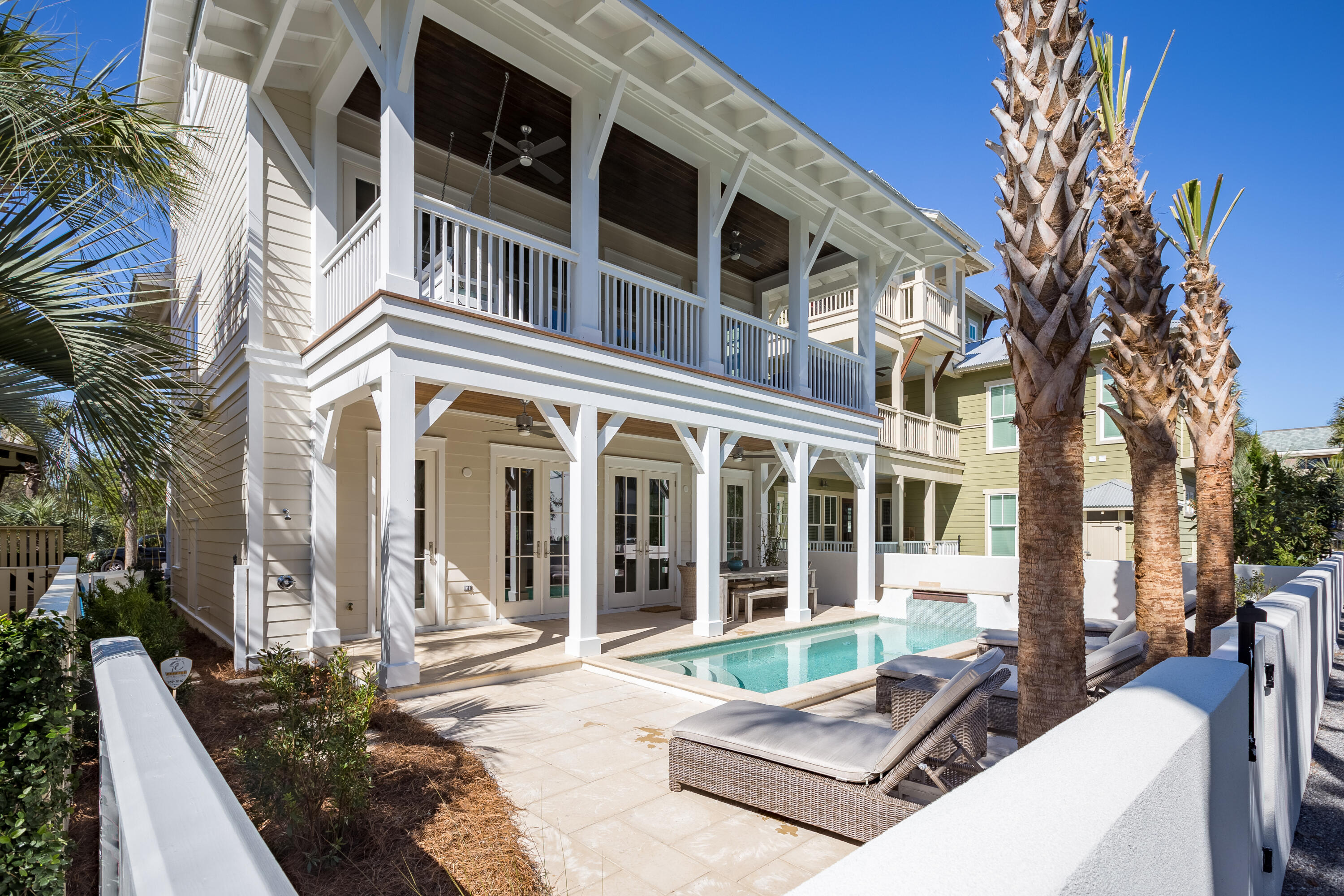 'Coconut Cloud' is remarkable home in the highly sought after community of Water's Edge. This gated community South of 30A is located just steps from Rosemary Beach, ALYS Beach, and Seacrest Beach. The neighborhood also has private deeded beach access that is only shared among the 34 homes in the community. This home, with its own private pool, is a perfect retreat for a second home or a rental property. Every room, other than one bunk room has its own ensuite bathroom. Durable and beautiful, Peacock Pavers run throughout the first and second floors. Upon entering the home you see the open concept that flows perfectly between the living, dining, kitchen, and outdoor area. The master bedroom is also conveniently located on the first floor. The second floor has