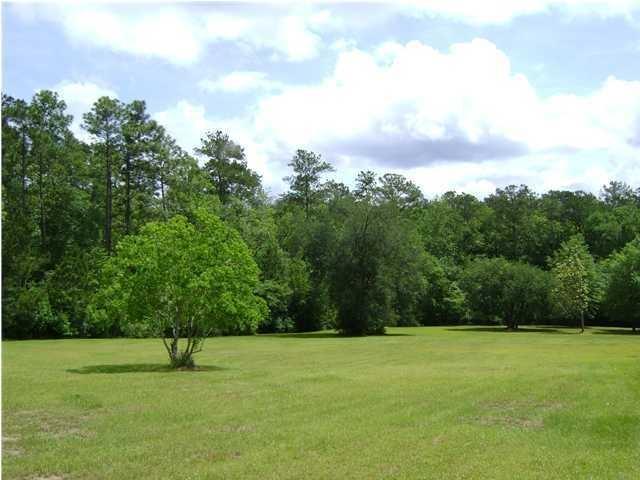 This is a very beautiful piece of property just waiting for that brand new dream home to become a reality ~ The lot has a gentle slope down to the creek. This property slopes perfectly allowing for drainage and for a possible walk out basement, style home. The lot has been partially cleared, yet leaving enough trees and timber for privacy. The seller has installed hundreds of feet of ''French'' drains on the upper and left portions of the property making this home-site ready. The property was also root raked making the soil ready to go and garden. There is a small utility shed on the property that will stay there for storage of equipment. This property is sold as is'', and this property has restrictions of no mobile homes or off site built homes, to be allowed. Brick exterior only.