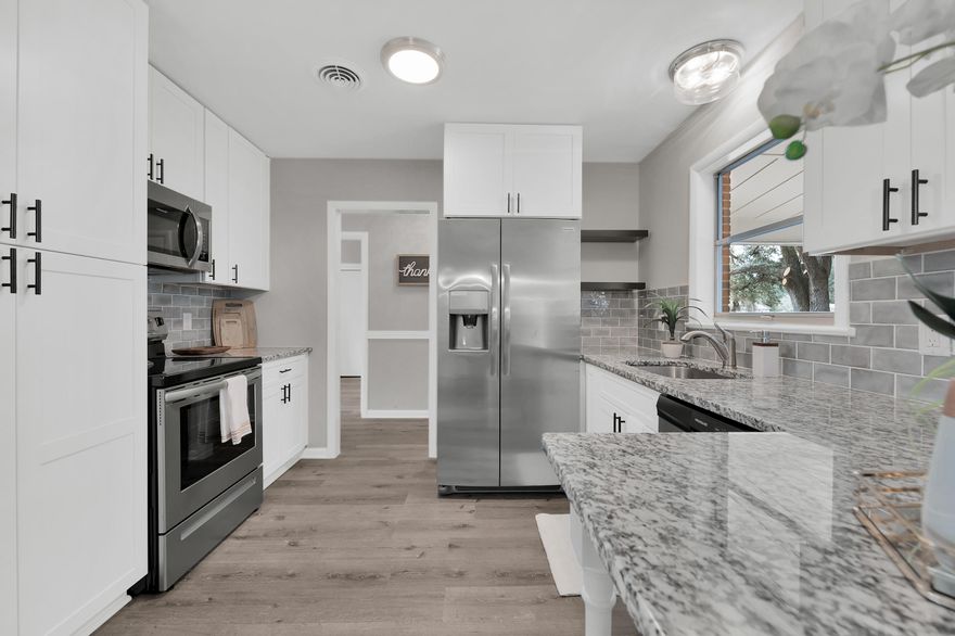 Come see this 3 BR, 2 BA, one-level home nestled on a quiet street in the heart of FWB! This beautifully renovated all-brick home boasts a split floor plan, updated kitchen and baths, as well as a new 3-dimensional shingle roof, HVAC system, and gas hot water heater! You will enjoy the flow of this home which feels much larger due to its open concept, vaulted ceilings, and dual sliding glass doors. The kitchen features 42'' shaker-style cabinets with European hinges and soft close drawers, elegant granite countertops, modern subway tile backsplash, oversized pantry, and stainless steel appliances. Both bathrooms have been upgraded with new vanities and mirrors and offer ample storage. Additionally, home has new vinyl plank flooring in all main living areas, as well the master bedroom and