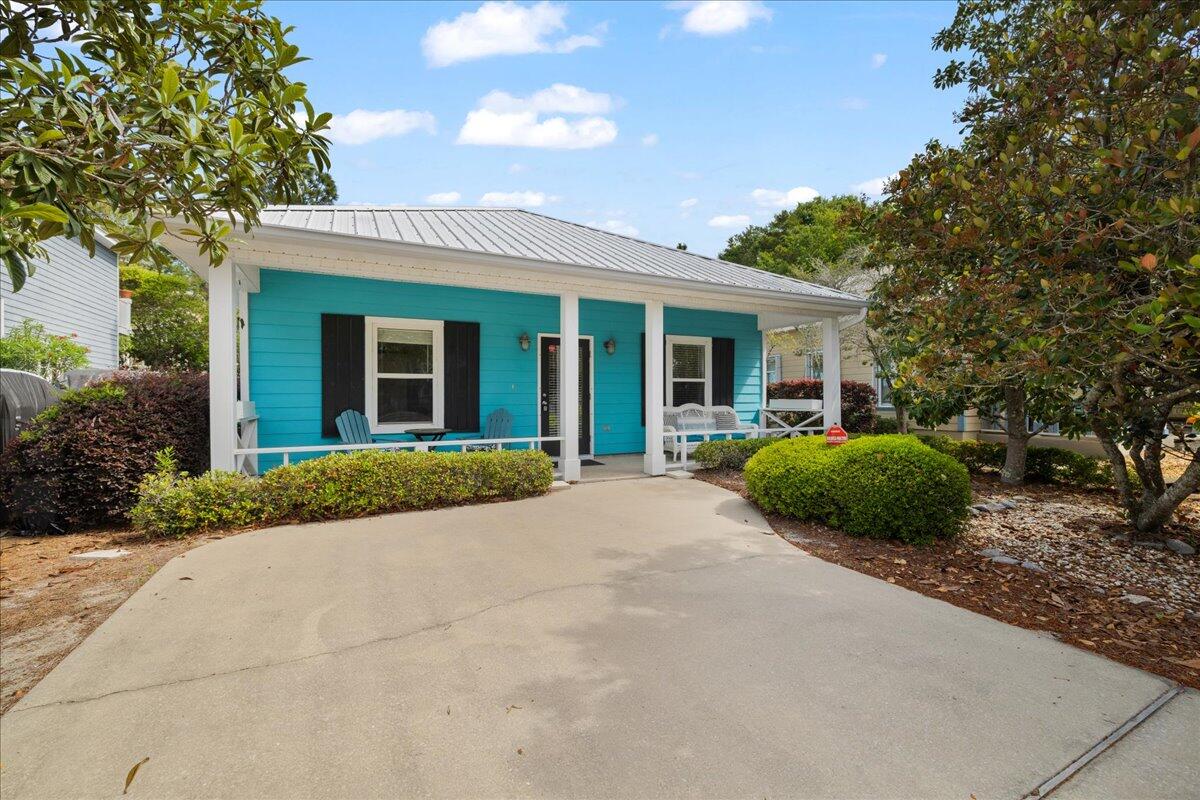 Located in the heart of Blue Mountain Beach along scenic 30A, this charming Florida cottage is just minutes from white sandy beaches, nature trails, boutique shopping, and local dining. Nestled in the sought-after Ventana Dunes community, this single-level home offers relaxed coastal living with over 1,200 sq. ft., 3 bedrooms, and 2 bathrooms. Step inside to find high ceilings, an open floor plan, an eat-in kitchen with a breakfast bar, and an adjacent dining area. The living room features an electric fireplace, while the large laundry room offers built-in shelving for added storage. Enjoy the outdoors from your screened-in back porch or private fenced yard, complete with beautiful scrub oaks, magnolia trees, and low-maintenance landscaping. The community features a beautifully resurfaced pool (Fall 2024) and brand-new pool furniture. Home sold furnished. Contact us today for a private tour!