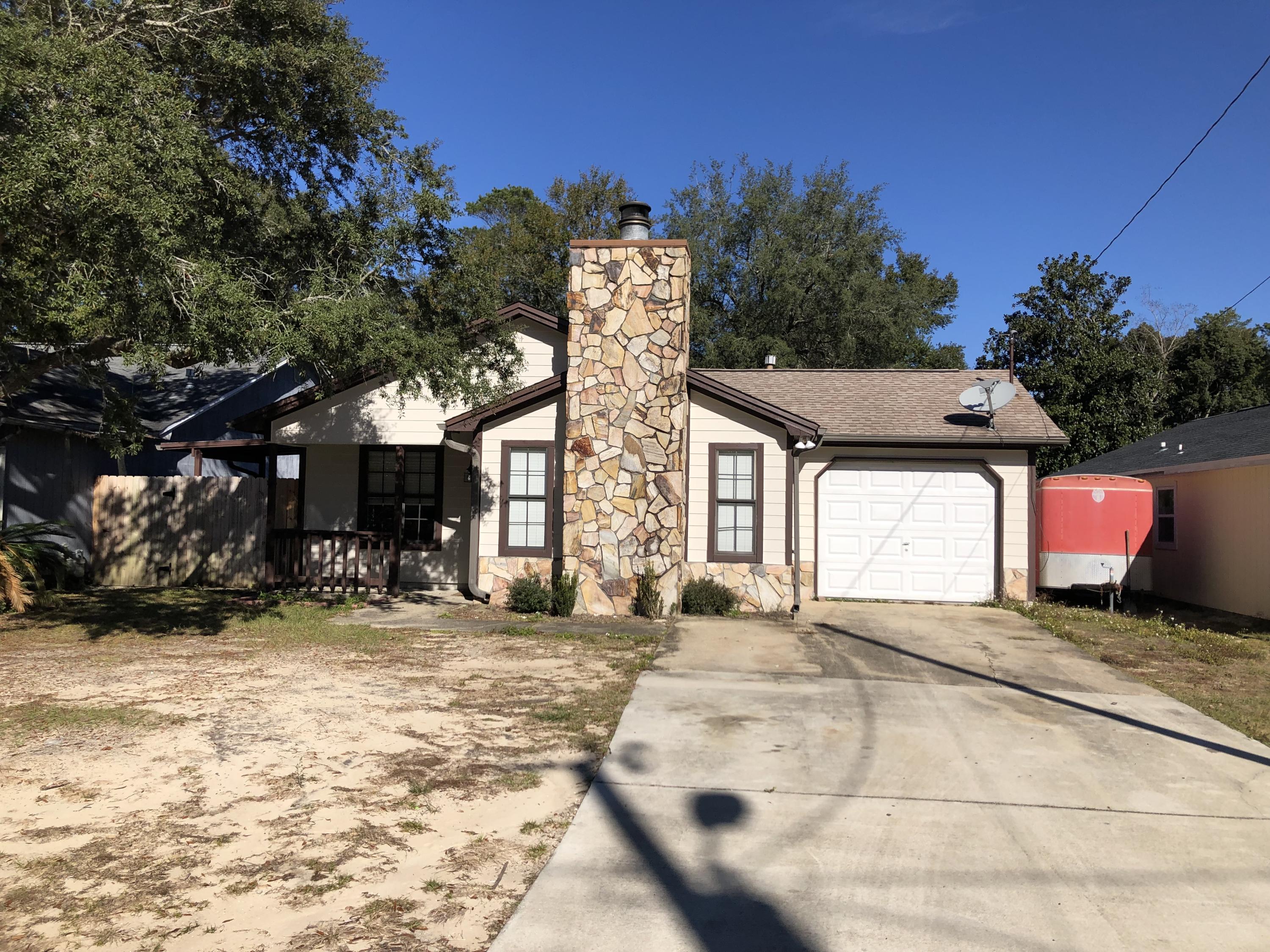 This great 3 bed, 2 bath, 1 car garage home offers cathedral ceiling and fireplace the living room, separate dining area, bathtubs in each bathroom, ceiling fans throughout, walk in closet in the master bedroom. Dimensional shingle roof new in 2012 and HVAC system new in 2015. The kitchen has gas range/oven. Exterior has newer gutters, fully fenced in back yard. Located in the heart of Niceville near Northwest Florida State College, the Niceville Children's Park, recreation fields and A+ rated schools.