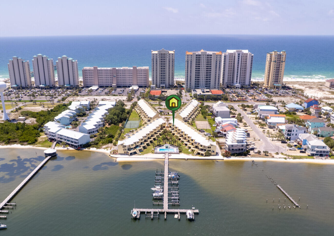 Beautifully renovated and fully furnished Navarre Beach townhome in the sought-after Buena Vida community! This property features Gulf and Sound views, an open-concept living/dining area, and a fully updated kitchen with granite counters and stainless appliances. Spacious bedrooms, including a top-floor primary suite with private balcony, oversized closet, and en suite bath. New luxury vinyl flooring, stacked washer/dryer, and mounted TVs in all bedrooms. Enjoy the large third-floor balcony and oversized deck overlooking the pool and lush grounds. Includes 1-car garage, bonus room, and 2 additional parking spaces. Assigned boat slip with power/water and newly installed 12,000lb top mount boat lift included. Community amenities: beach, pool, tennis, and dock.