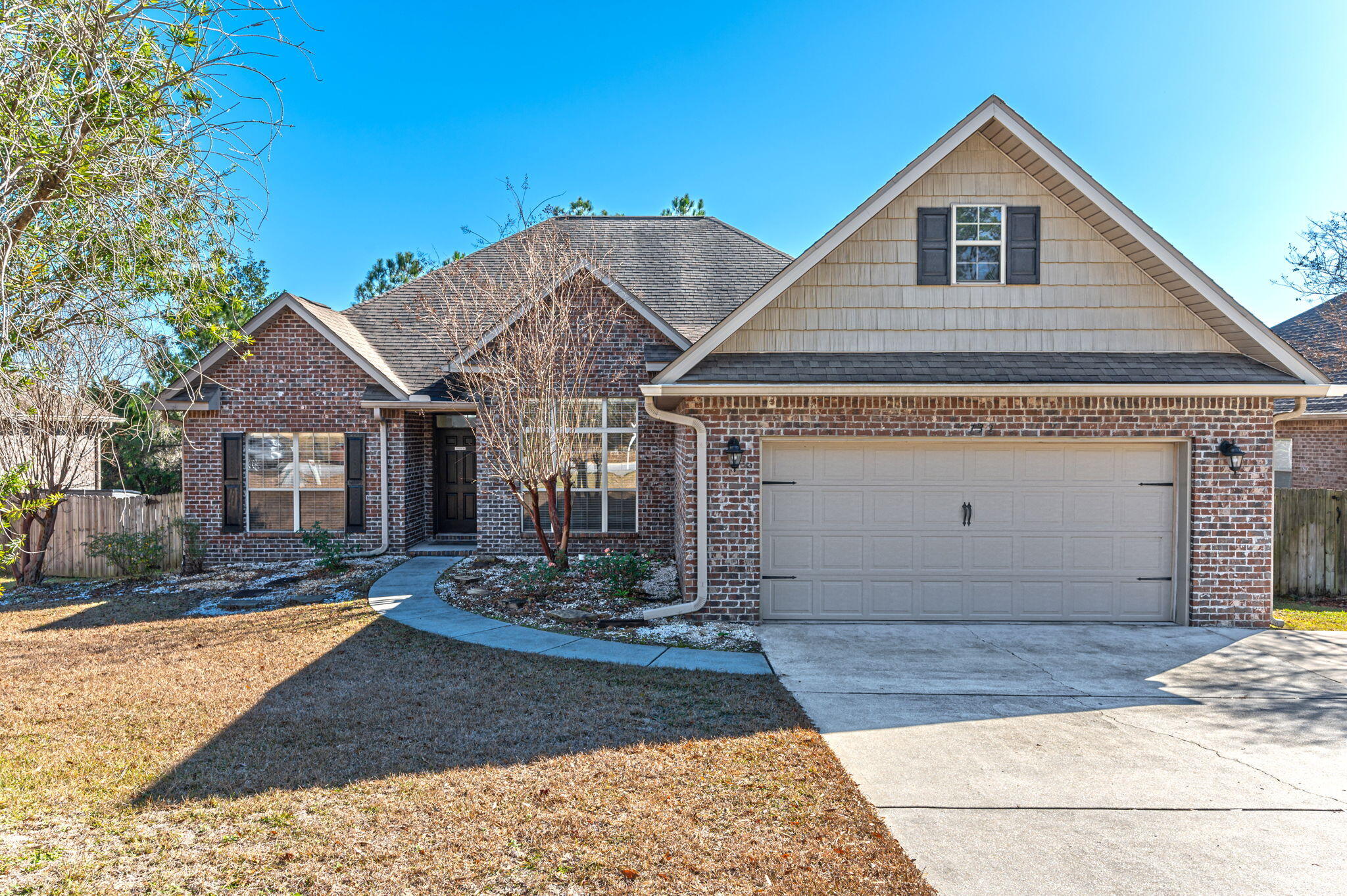 Nestled in the heart of South Crestview, this exquisite 3-bed, 2.5-bath home radiates modern charm and functionality. Step into a haven adorned with new Pergo water-resistant laminate floors and fresh interior paint. With A new fridge (2020) and contemporary toilets, convenience meets style seamlessly.The widened driveway effortlessly accommodates 6 vehicles, complementing the home's practicality. A sprinkler system maintains the lush landscape, enhancing the exterior allure. Embrace year-round comfort with an annually serviced AC unit while enjoying outdoor tranquility on the newly refinished composite deck.Carefully tended to, this home also offers peace of mind with an annual termite bond through Massey Pest Control.