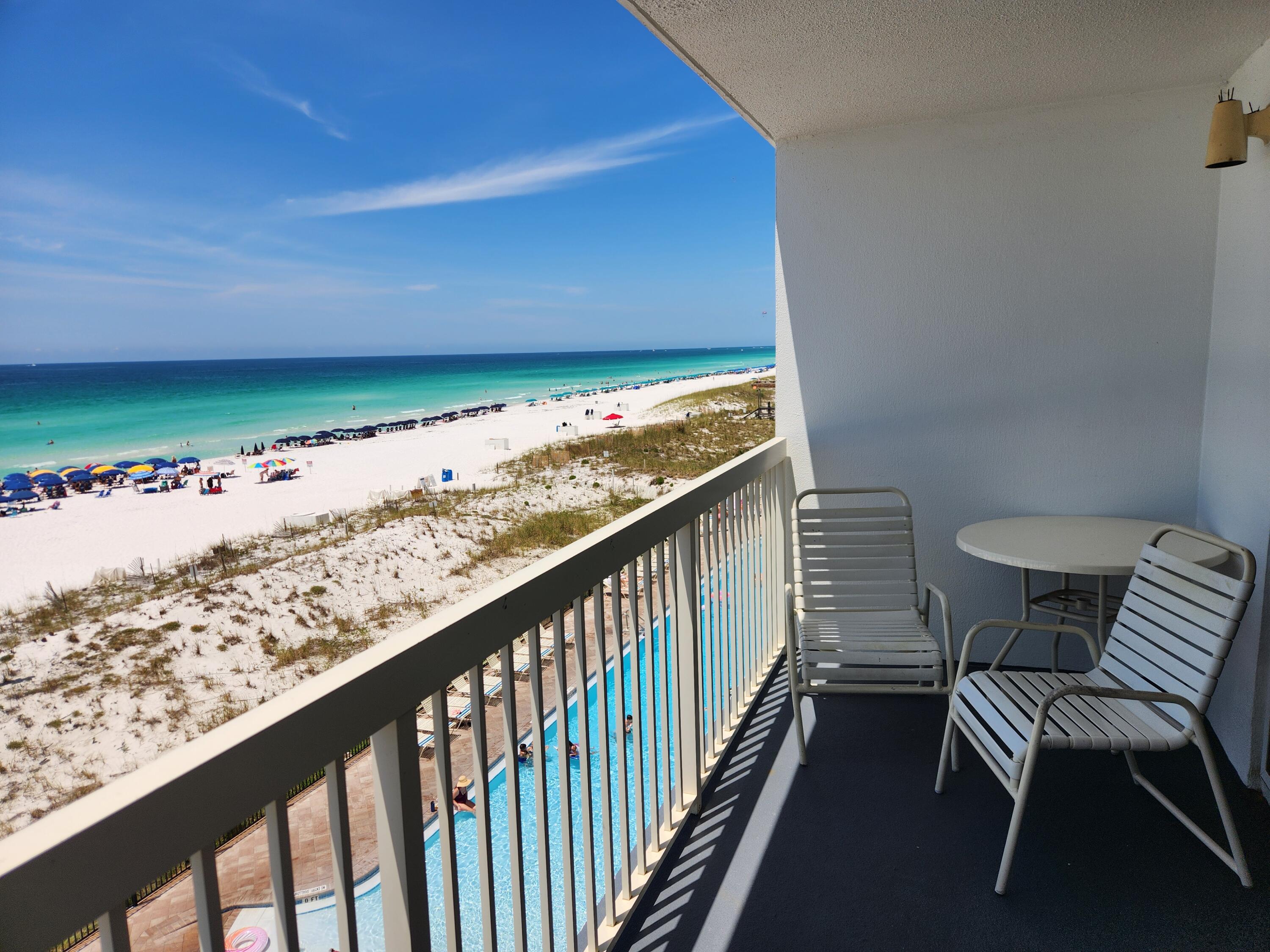 Welcome to Pelican 402, beachfront dolphin unit. Showcasing expansive views of the Gulf, sit on the balcony and feel one with the beach! Amenities include 3 pools, two of them heated in the winter. New 114 ft. zero entry pool right on beach w/12-seat spa, tennis court, covered parking, TIKI bar, Cafe, game room and sauna.