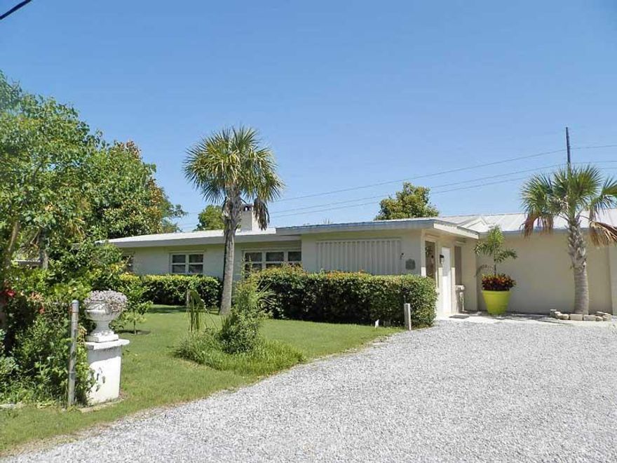 GREAT OPPORTUNITY FOR A BUILDER/INVESTOR!!! One of the largest lots in Crystal Beach. This property sits on a 180x154 lot and can be divided into 3 LOTS!!!! There is currently a Old Florida Cottage with added mother-in-law quarter, as well as a standalone studio and outside pool shower. The pool is new and one if its kind with outside deck and grill area. Crystal Beach is centrally located to beach, shopping and restaurants. All within walking distance. Two block from the beach! Buyer to verify all dimensions.