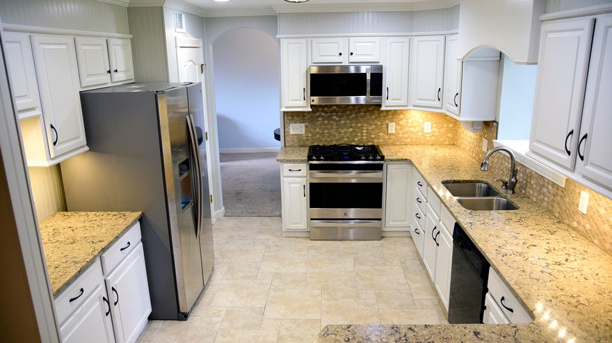 What a perfect home and neighborhood! Bright and cheery, this home allows for everyone to have space with 3 living areas: living room, family room and heated/cooled sunroom! High ceilings give a sense of grandeur and yet the home has a very cozy feel. The kitchen has been updated and opens into the family room with a fireplace and a breakfast bar. Granite counters, tile floors, backsplash, and stainless appliances make the modern kitchen ideal. There is even a window to enjoy the backyard while you work. The sunroom makes an excellent gym area, playroom,office or that craft room that you have always wanted. The roomy upstairs provides privacy and can be adapted to a variety of uses, bedrooms, office, hobby room orguest rooms. The backyard is completely fenced for the safety and fun