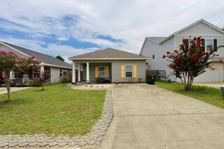 Welcome to this charming 3-bedroom, 2-bath cottage that blends coastal flair with laid-back bohemian style. Perfectly set up as a turnkey Airbnb or primary residence, this home is just minutes from downtown Pensacola, a short walk to the local park and marina, and only a 6 minute drive to the NAS main gate. Step inside to enjoy new flooring (2022), resh interior paint (2025), and a brand-new HVAC system (2024), lansdcaping, pressurewashing an extened patio pavers(2025), New Kitchen peninsula (2025) all the updates you need for comfort and peace of mind. The spacious backyard is a true oasis, beautifully landscaped with a shaded seating area surrounded by blueberry and blackberry bushes, a lemon and banana tree and a and a fragrant rosemary bush--ideal for relaxing or entertaining. Whether you're looking for an investment property, vacation getaway, or cozy home near the coast, this unique gem has it all. Don't miss your chance to own a slice of Pensacola paradise!