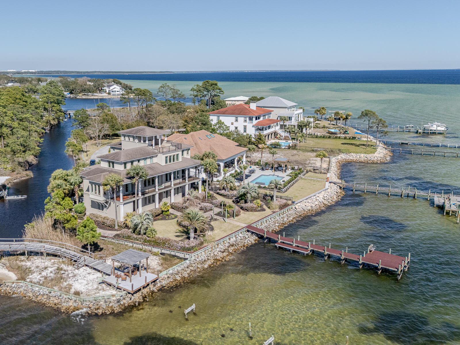 Stunning Waterfront Luxury Home with Panoramic Bay Views!Imagine waking up every day to breathtaking panoramic views of Choctawhatchee Bay. The best part? You can enjoy these stunning vistas from every angle on the top floor of this exceptional home. Whether you're sipping your morning coffee or unwinding at sunset, the views are nothing short of spectacular--stretching from Shalimar and Fort Walton Beach to Destin and the Mid-Bay Bridge.With over 100 feet of deeded waterfront access and two private docks, this property is nestled within a gated island community, offering both privacy and exclusivity. You'll be just minutes from beaches, airports, military bases, and shopping--yet tucked away from the crowds of tourists.