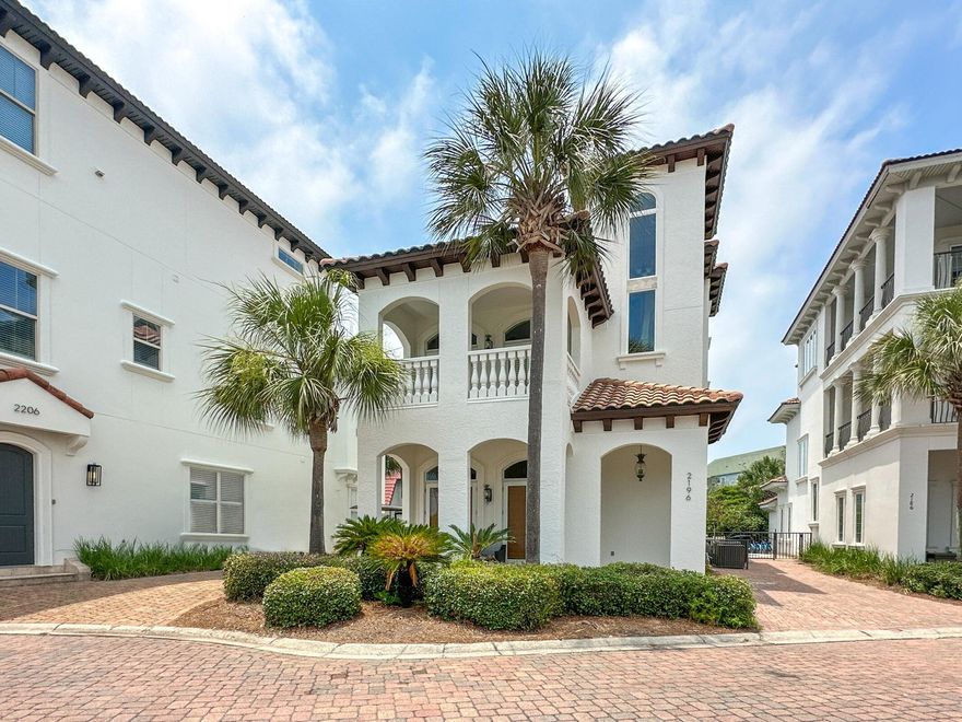 This three-story Mediterranean-style home at Palmeira Villas in Blue Mountain Beach is beautiful! Just steps from the beach, with a private pool - this lovely home is a perfect investment property or full-time residence. The home is warm and inviting with features including arch details, 18-inch travertine floors, columns, and coffered ceiling. Double French doors with arched transom windows invite you into the open main living area, conveniently situated on the ground floor. A built-in media cabinet and dry bar are ideal for entertaining. The kitchen features a center island with bar seating for two, a breakfast bar, stainless steel appliances, granite countertops, and travertine subway tile backsplash. With two master suites on the third and second floors, two additional guest rooms, and a secondary living room on the second floor, this house was made for guests to enjoy. The backyard features a private pool, and open patio and grilling area. Just steps from the Blue Mountain Beach Access, beach days are made easy. Located along 30A you're just minutes from enjoying all the entertainment, dining, and fun along 30A!