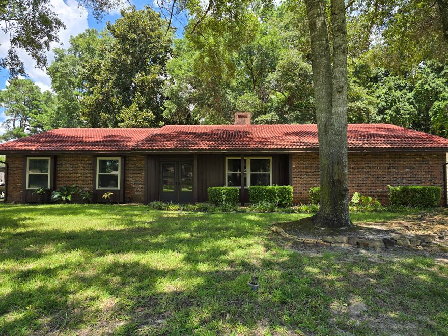 Located near Eglin AFB ,this well-maintained, Gary Miller-built brick home sits on a spacious lot in the heart of Central Niceville and is move-in ready! Step inside from the screened front porch into a spacious living room, featuring a vaulted ceiling, a cozy fireplace, and an abundance of natural light. The open-concept kitchen offers abundant cabinetry, ample counter space, and a convenient breakfast bar. It seamlessly flows into a second living area and dining room--perfect for entertaining or everyday living. Sliding glass doors from the dining area lead to a screened-in back patio, ideal for enjoying the outdoors year-round. Adjacent to the family room is a flex space that can serve as an office or hobby room. It also offers washer and dryer hookups as an alternative to the oversized two-car garage, where laundry is currently located. The primary suite overlooks the private backyard and features a spacious en-suite with walk-in shower and a generous walk-in closet. Two additional bedrooms and a full guest bathroom complete the interior. 

Additional highlights include:
Side-entry garage for curb appeal and function
Greenbelt buffers to the right and back of the home for added privacy
24x20x9 workshop built in 2020, ideal for projects or storage

Recent Updates Include:
2020: Water heater and new workshop
2021: Garage door and expanded driveway
2023: Hurricane-rated windows throughout
2024: New HVAC system

Don't miss this opportunity to own a thoughtfully updated home in a desirable Niceville location. Schedule your private showing today!
