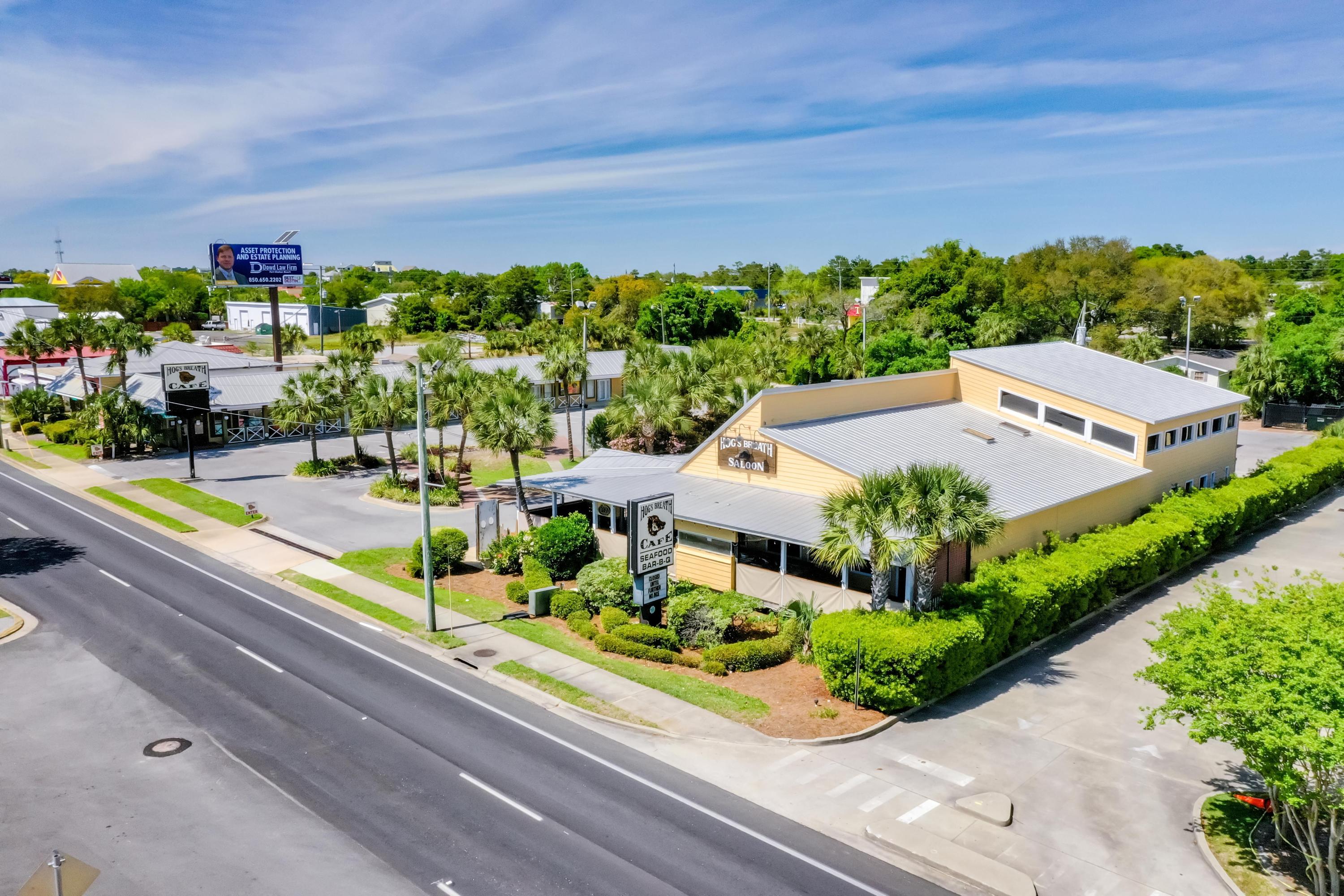 Superb 1.9-acre assemblage in the Harbor District of Destin, Florida, which coveted site has been operated as the Hog's Breath Cafe & Saloon for decades. The (5) contiguous parcels of Okaloosa County are located in the City of Destin and extend from Highway 98 (aka Harbor Boulevard) to Mountain Drive, and includes a fully-fixtured restaurant, special events space, multiple interior and exterior bars, expansive covered decks, operating smokehouse and separate icehouse, retail store, former in-line motel, office cottage, and an abundance of parking. This rare, second generation restaurant opportunity offers a turnkey, revenue-producing site for your food, beverage, and retail concept. The improvements have been well-maintained throughout the years. A 4COP beverage license....