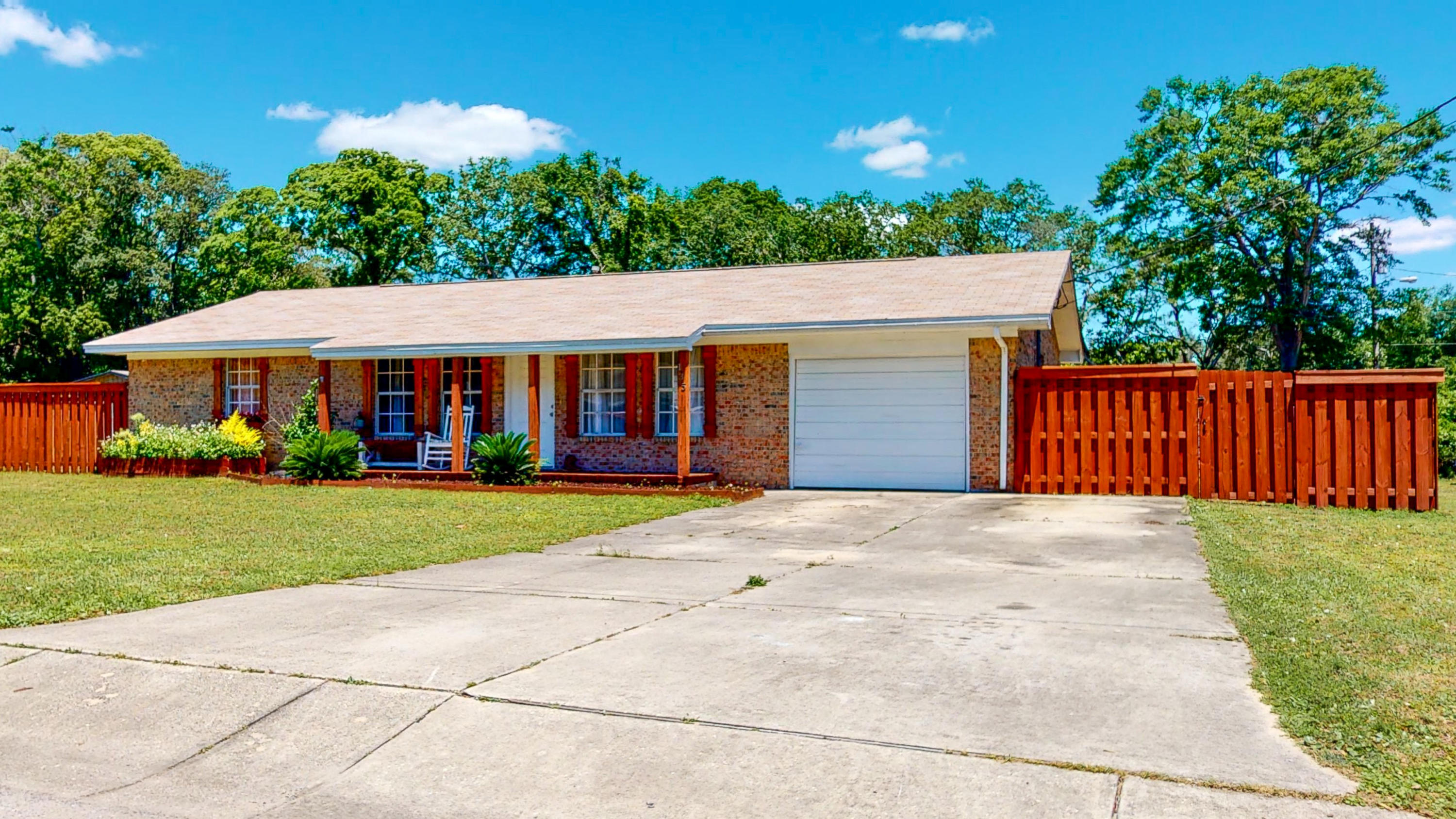 Get ready to fall in love with this single story, 3 bedroom, 2 bath ranch style home. Centrally located in Fort Walton Beach, near Eglin AFB, Hurlburt Field, Restaurants, Shopping and the beach! The owners have done a tremendous job on the kitchen remodel with new butcher block counter tops, farm sink, subway backsplash, and new stainless steel appliances with a gas stove. They didn't stop there-- they continued the kitchen outdoors with a new outdoor kitchen! Open deck with custom seating, fenced in back yard on a corner lot. This is a home you don't want to miss!