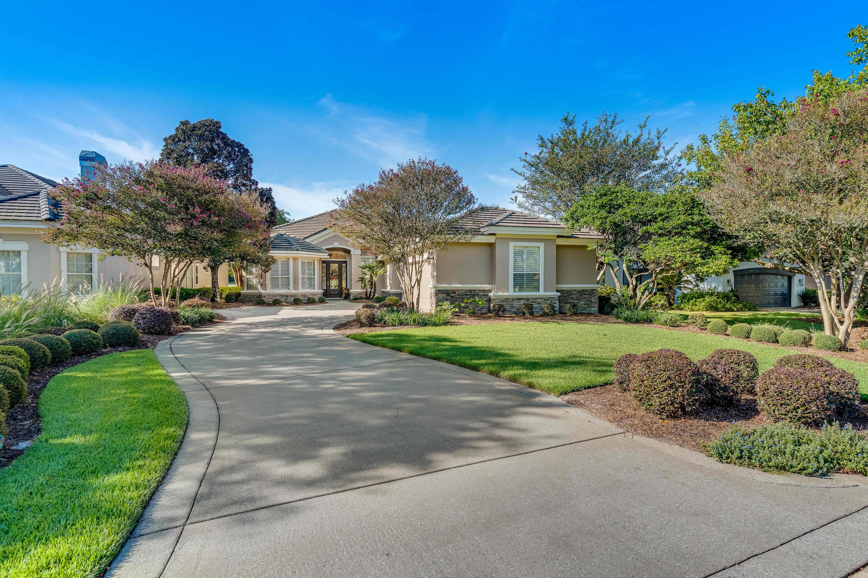 Nestled in the highly sought-after Carriage Lane of Kelly Plantation, this custom-built, single-owner home offers a rare opportunity to own a piece of paradise. As you approach the property, you'll be captivated by the breathtaking water views of both the tranquil lake and the golf course view. The stunning scenery continues inside, with raised tray ceilings throughout the home that draw your eye toward the serene water vistas.Waking up is a delight in the master suite, which offers a picturesque view to greet you each morning. The heart of the home, the luxurious kitchen, is a chef's dream, showcasing a unique combination of rich wood and elegant granite countertops. For the modern entertainer, a built-in speaker system in the kitchen and living room creates the perfect ambiance for any occasion.
This home also features a versatile additional room, ideal for a home office, den, or studio. Step outside and relax on the lanai, a perfect spot to enjoy the beautiful Florida weather while benefiting from its energy-efficient design.
Living here means enjoying the best of both worlds: a peaceful, private retreat that is also just a half-mile from Destin's world-famous beaches, award-winning restaurants, and premier shopping. This is more than just a home; it's a lifestyle.
