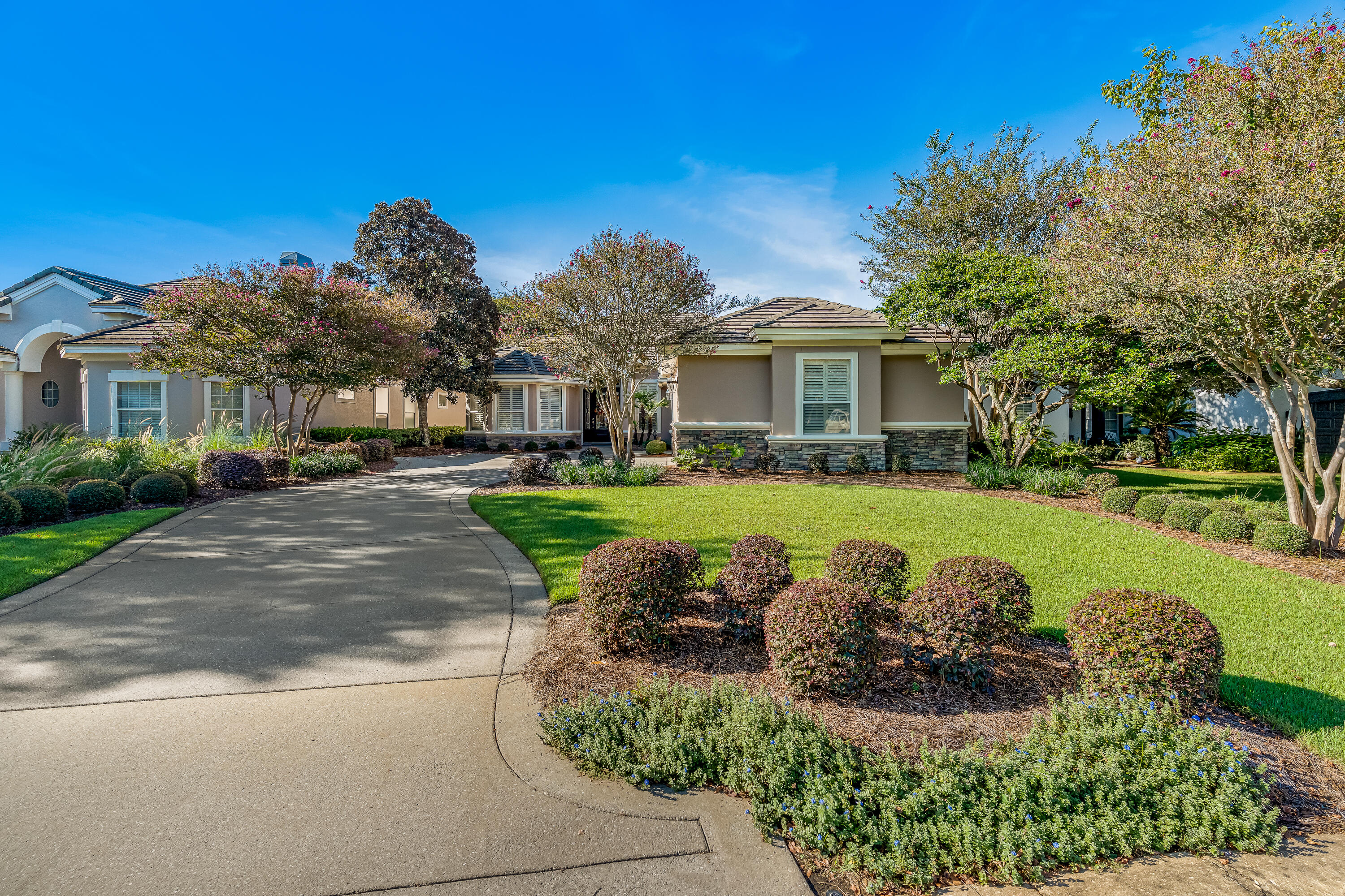 Nestled in the highly sought-after Carriage Lane of Kelly Plantation, this custom-built, single-owner home offers a rare opportunity to own a piece of paradise. As you approach the property, you'll be captivated by the breathtaking water views of both the tranquil lake and the lush golf course. The stunning scenery continues inside, with raised tray ceilings throughout the home that draw your eye toward the serene water vistas.Waking up is a delight in the master suite, which offers a picturesque view to greet you each morning. The heart of the home, the luxurious kitchen, is a chef's dream, showcasing a unique combination of rich wood and elegant granite countertops. For the modern entertainer, a built-in speaker system in the kitchen and living room creates the perfect ambiance for any occasion.
This home also features a versatile additional room, ideal for a home office, den, or studio. Step outside and relax on the lanai, a perfect spot to enjoy the beautiful Florida weather while benefiting from its energy-efficient design.
Living here means enjoying the best of both worlds: a peaceful, private retreat that is also just a half-mile from Destin's world-famous beaches, award-winning restaurants, and premier shopping. This is more than just a home; it's a lifestyle.