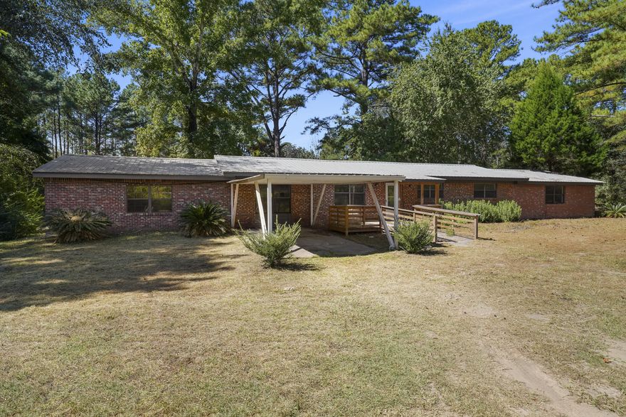 Two gorgeous homes on 4.6 acres . The main home is a 4/2 with approx. 2500sf and has been remodeled. The guest house (built in 2007) is approx 1100 sf. and is rented month to month (is in good shape!). New Hvac, metal roof and ready to go! Should pass 4 point! Large rooms and spacious layout compliment the sprawling 4+ acres. Build your new empire today! Close enough, but far away! VA and FHA welcome!
