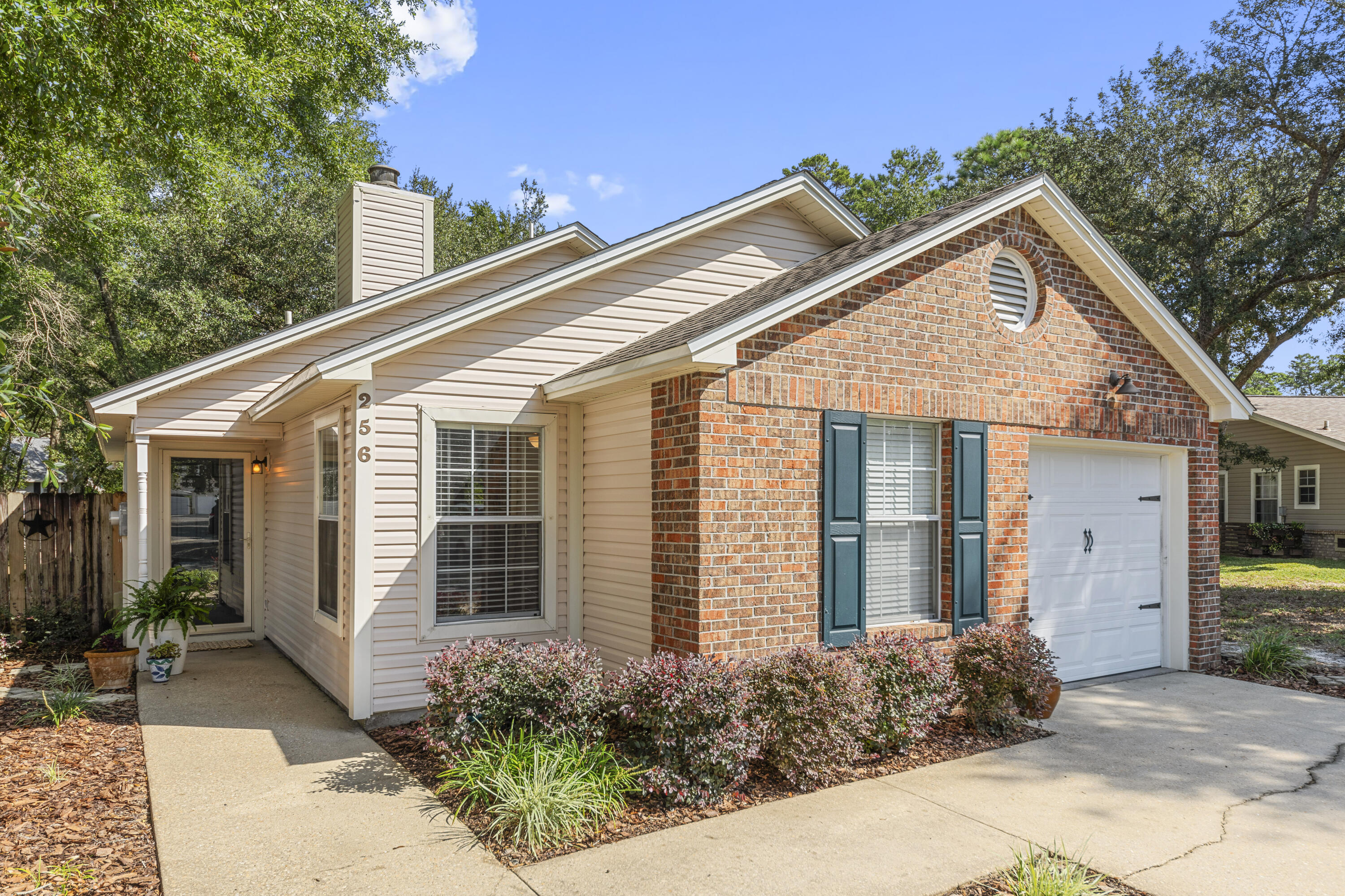 Welcome to this charming home located in the beautiful Bluewater Bay community, where you can enjoy amenities like a golf course, marina, and scenic walking trails. This prime location offers easy access to schools, shopping, dining, and a quick commute to Eglin AFB, Duke Field/Special Forces, and nearby cities.  Inside, you'll find beautiful wood laminate flooring throughout and a cozy living room featuring a wood-burning fireplace--perfect for gatherings. The thoughtfully designed kitchen boasts Quartz countertops, a stylish subway tile backsplash, and stainless-steel appliances. With ample storage, a spacious pantry, and generous counter space, meal prep is a breeze. The inviting kitchen nook provides a delightful spot for breakfast and dinner. Retreat to the spacious owner's suite, complete with a large closet and an ensuite bathroom. The second bedroom is versatile and ideal for a study, conveniently connected to the shared full bathroom.  Step outside to relax on the covered patio, then follow the path to a lovely open spaceperfect for seating, a fire pit, or whatever your heart desires. Enjoy low outdoor maintenance with a front yard irrigation system using well water, while your HOA takes care of your front yard's curb appeal.  Don't miss your chance to make this lovely home yoursschedule your showing today! Please note that a lender pre-approval letter is required with all offers.