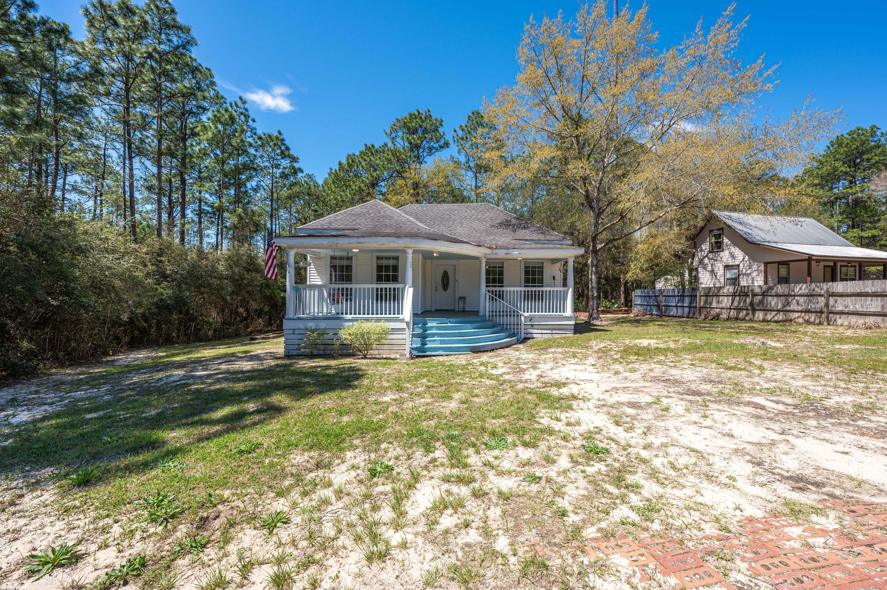 Southern charm, check! If you would like to spend your time less than 30 minutes from the worlds most beautiful beaches, this may be the one for you. 3 bedrooms, 2 full bathrooms with a split shower/tub in the master bathroom. This home has a large, new back deck and a wonderful front porch perfect for spring days in Florida. Enjoy a generous sized lot and no neighbors to the south. Reach out to your agent in a hurry before this one is gone.