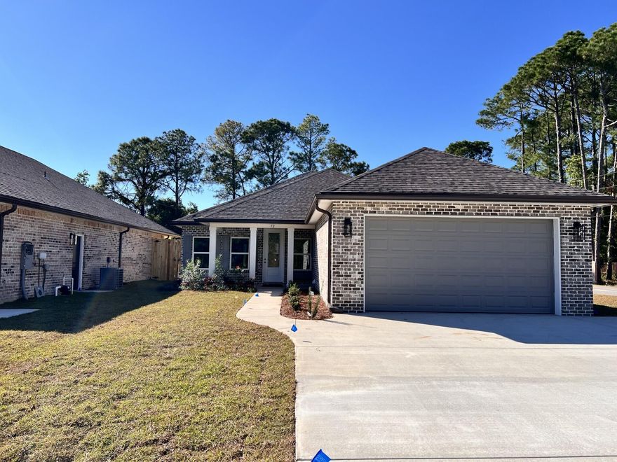 Come see this beautiful 4 bedroom,  2 bath all brick home sitting on a corner lot and is located at the East end of Niceville. The seller pays 10,000 towards the buyer's closing cost, doc stamps on deed, & all title insurance and title fees.  You'll absolutely LOVE this OPEN floor plan featuring 9ft. ceilings throughout and 10ft where reverse trey ceilings are located. This home boast many custom amenities. 8ft front and garage door, extra parking pad for a boat.  The kitchen is divine, featuring white custom cabinets, soft close drawers, farm sink, pantry, undermount lighting under cabinets and quartz countertops throughout. The island bar has an 18 inch over hang, a reverse trey ceiling in the family room with changeable lighting for seasonal events.  Enjoy the floor plug added to he family room for phone chargers, lamps without cords and hindering walkways. Love entertaining? The kitchen and family room open up to a screened porch to relax with an extra paver pad for grilling and an extra patio set. The master bedroom has a reverse trey ceiling with recess lighting and opens up to a custom master bath. You'll absolutely love everything about this bathroom! It's wonderful for relaxing, with endless hot water with it's tankless hot water heater and the deep 6ft soaker tub. The master shower, boast custom tile with a rainhead, and 2 other separate sprayers, bench for sitting while shaving and seamless glass. You will actually want to do the laundry, with a custom folding table with quartz countertop, hanging bar and custom designer hooks attached. When you want to relax, and rewind, the back yard is the place. You'll enjoy a fully sodded yard, full gutters, sprinkler system that works off a separate well and a 6 ft. privacy fence, making up-keep easy. This home has everything and sits on a corner lot. Theres an alley road for these homes that give an entrance to the back yard as well. A double gate has been installed on the back right fence. For energy efficiency, the builder has installed upgraded spray foam in the roof. You will also enjoy the storage above the garage. The whole family will love the location! This builder takes great pride in his homes and it shows! Five new homes are under construction. Your close to restaurants, a large park with boat launch and Eglin Air Force Base, Special Forces, Emerald Coast beaches, shopping, hospitals and more. Call today for a viewing, and Welcome Home!