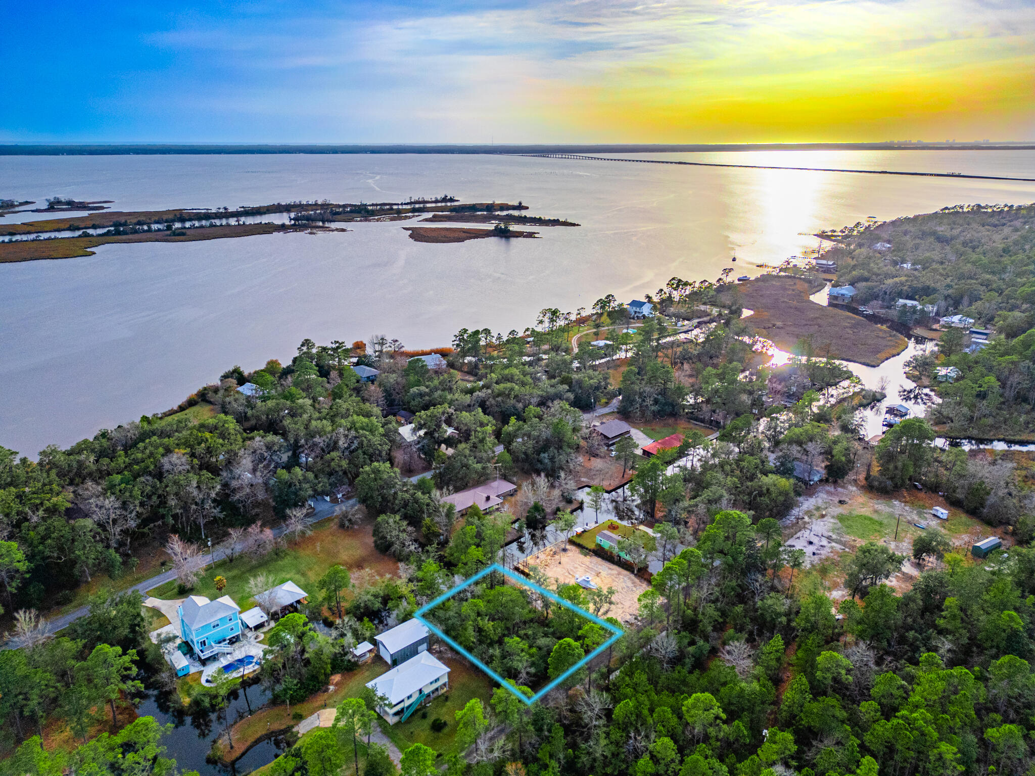 This WATERFRONT property offers a rare opportunity to build your dream home in a peaceful and private setting with no HOA restrictions. Located along a canal with direct access to the Choctawhatchee Bay, these lots are perfect for creating a tranquil retreat. This property offers canal frontage & provides space for your custom development.Sewer lines are conveniently located on Wilson Way. Many of the neighboring properties feature boats docks along the canal.The surrounding neighborhood is seeing new, high-quality homes being built, making this an excellent investment for both homeowners and builders. Whether you're looking to enjoy waterfront living, with easy boat access or a quiet, scenic location this property offers an incredible opportunity.