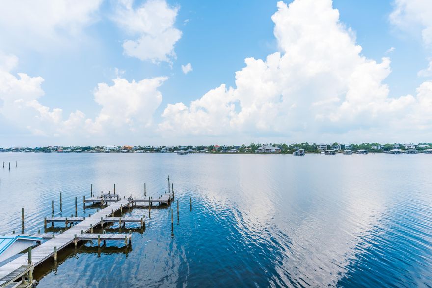 Florida living at it's finest! This MUST SEE condo makes for your perfect beach retreat! Relax and unwind on your private over sized sun deck and enjoy the incredible sunset views overlooking the intracoastal waterway (Ole River) and Ono Island. Stroll across the street to the deeded beach access and watch frolicking dolphins play in the beautiful waters of the Emerald Coast! This freshly painted top floor unit offers new stainless steel appliances, an open floor plan, outdoor storage closet, over sized private patio/sun deck, large community pool, tennis courts, basketball courts, deeded beach access, boat dock with first come first served boat slips, a boat storage yard and is being sold fully furnished. This location is fantastic with 3 Florida State parks located within 5-20 minutes