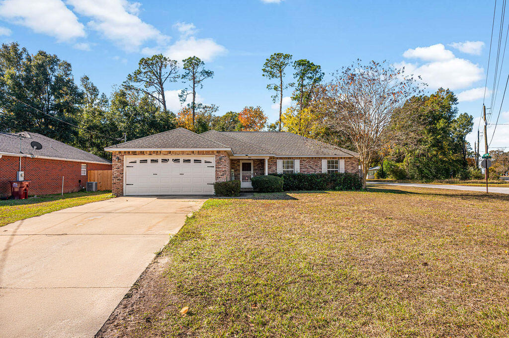 Military-Friendly Gem in Crestview! Welcome to your perfect home base! This 1,446 SF, 3-bedroom, 2-bathroom charmer is designed for comfort and convenience. Located on a spacious corner lot, this property offers a large fenced backyard--perfect for pets, outdoor gatherings, or just relaxing after a long day. The large driveway is perfect for a boat!The 2-car garage provides ample storage for vehicles, gear, or hobbies. Located just north of I-10, ensures an easy commute to Duke Field and Eglin Air Force Base.Convenient to shopping, dining, & major highways, putting everything you need right at your fingertips while maintaining the peaceful vibe of Crestview living. Just 30 minutes to the beaches of Destin! Why rent when you can own this great property?