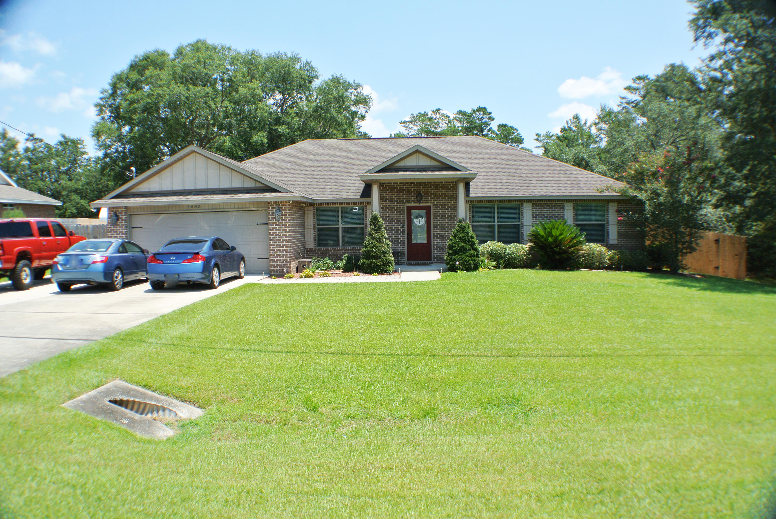 This is a BEAUTIFUL 4-bedroom, 2-bath split open floor plan. This home is MOVE-IN ready and located in Holley by the Sea. Not only is the location perfect, but this house also has updated granite countertops and beautiful hard wood flooring throughout most of the home. This BEAUTY sits on a .64-acre lot that has a concrete RV parking pad with full hooks ups on the side of the house. Privacy wood fence has a double gated entry off the garage side to allow access to RV parking. This home also has an additional detached garage in back with covered boat parking.