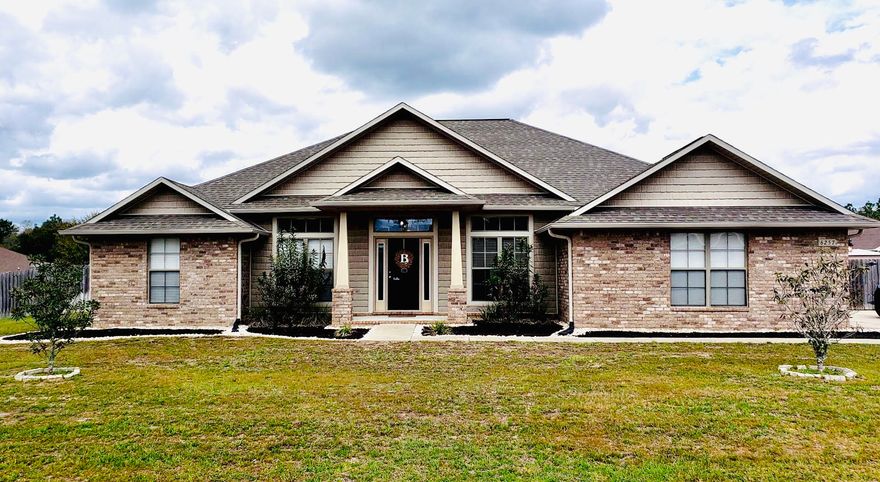 MUST SEE! Custom brick home on -1/2 acre with great curb appeal. Grand foyer leads to living room with cathedral & trey ceilings & cozy fireplace. Open kitchen features high end appliances tons of storage huge island & breakfast nook. Split floorplan, separate guest wing, & master suite opening to screened Florida room. His & Hers walk in closets double vanity garden tub and shower. Spacious rooms with large closets and 2 additional bathrooms. 2 bonus flex rooms ideal for formal dining and an office. Carpet in bedrooms with tile flooring throughout rest of the home. Energy efficient with Nest thermostat, insulated tint windows, & ceiling fans. Wide driveway with side entry 2 car garage. Fully fenced yard with plenty of space for family and pets. Leveled area for above ground pool or added pat